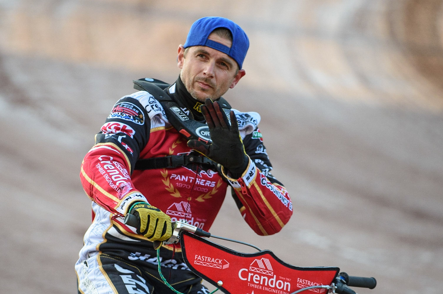 MANCHESTER, UK. AUG 9TH  Peterborough Crendon Panthers  rider Hans Andersen waves to the crowd on the pre match parade during the SGB Premiership match between Belle Vue Aces and Peterborough at the National Speedway Stadium, Manchester on Monday 9th August 2021. (Credit: Ian Charles | MI News)