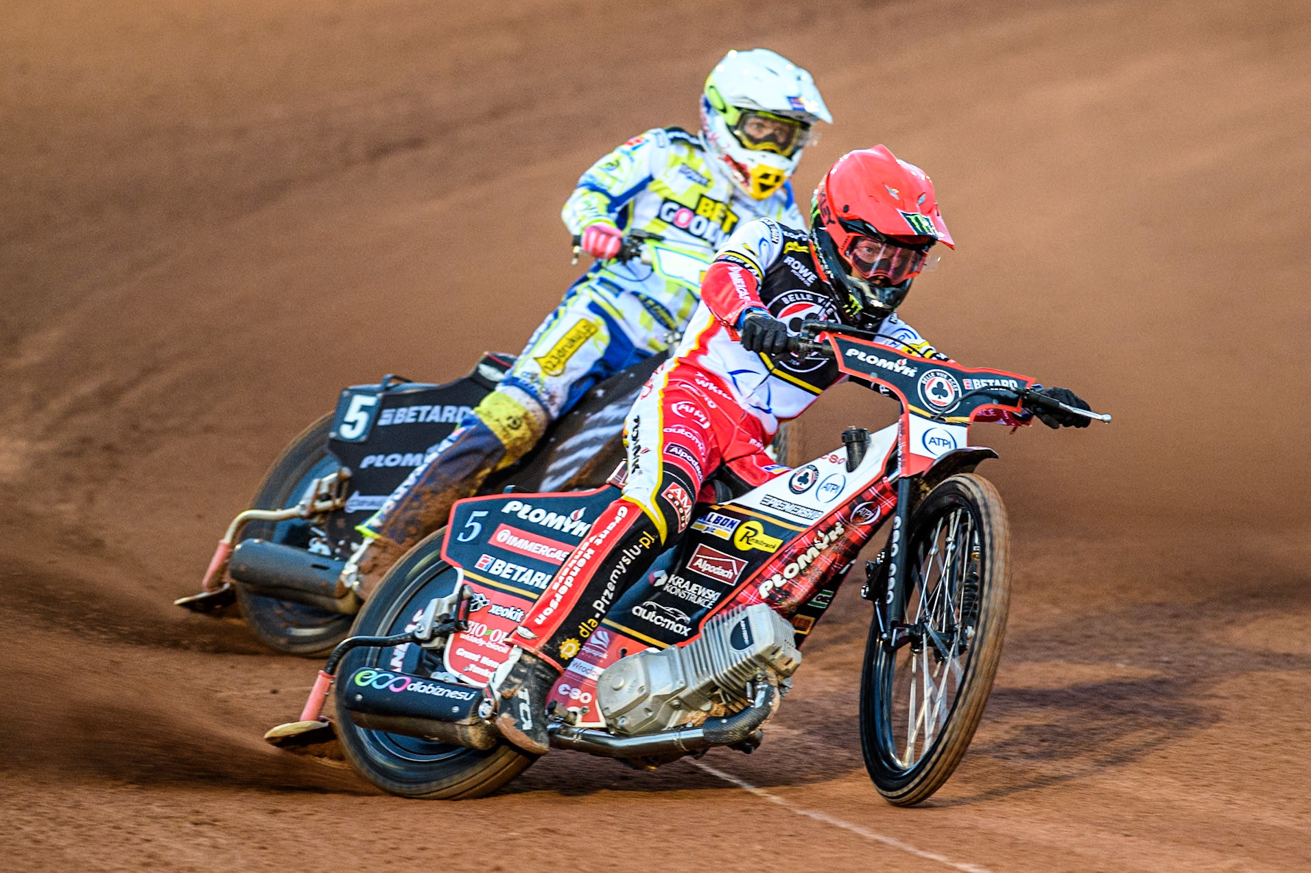 Belle Vue Aces' Dan Bewley in Red leading Oxford Spires' Maciej Janowski in White during the Rowe Motor Oil Premiership match between Belle Vue Aces and Oxford Spires at the National Speedway Stadium, Manchester on Monday 14th April 2025. (Photo: Ian Charles | MI News)