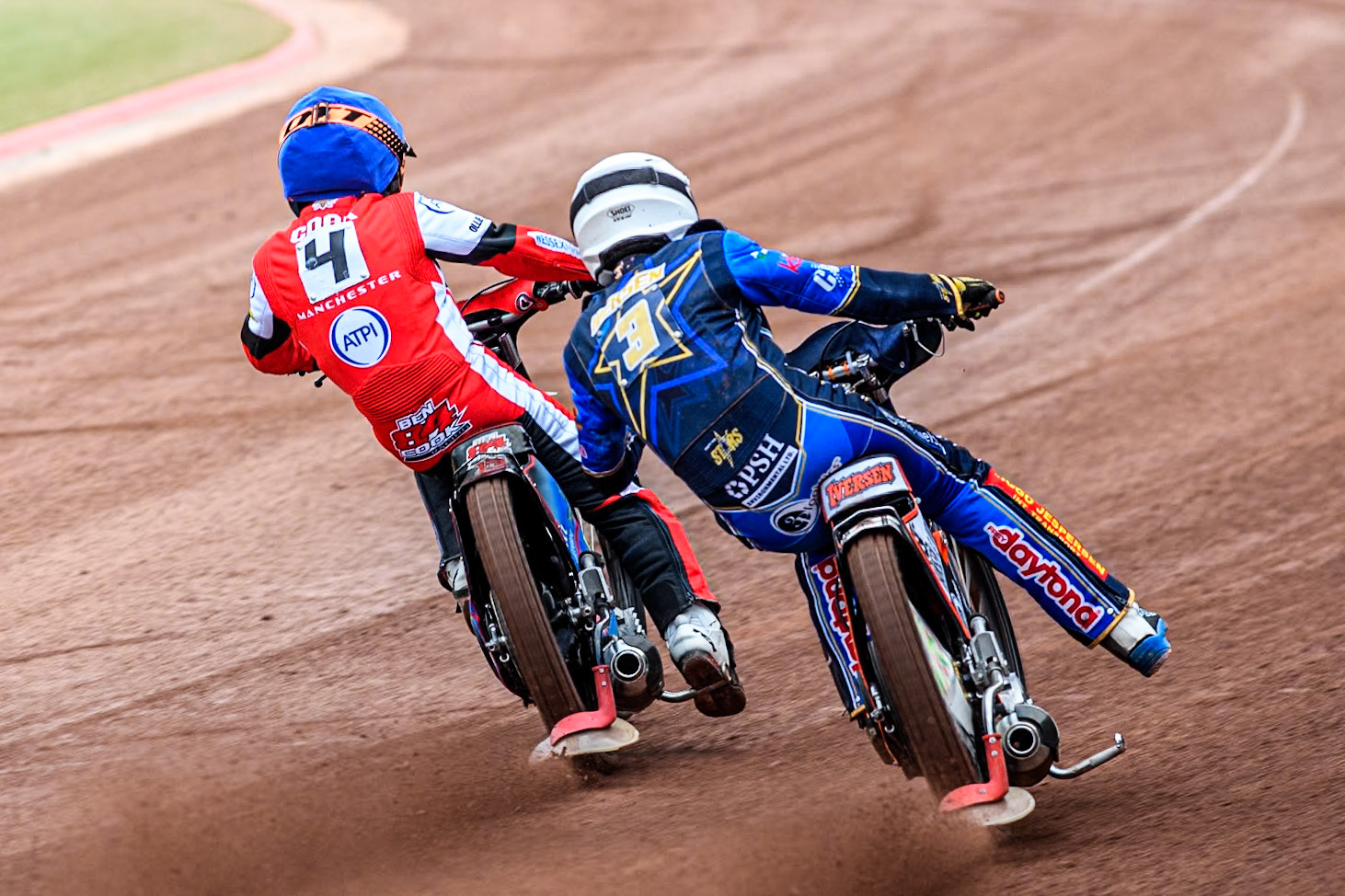 King Lynn Stars' Niels-Kristian Iversen in White chases Belle Vue Aces' Ben Cook in Blue during the Rowe Motor Oil Premiership match between Belle Vue Aces and King's Lynn Stars at the National Speedway Stadium, Manchester on Monday 20th May 2024. (Photo: Ian Charles | MI News)