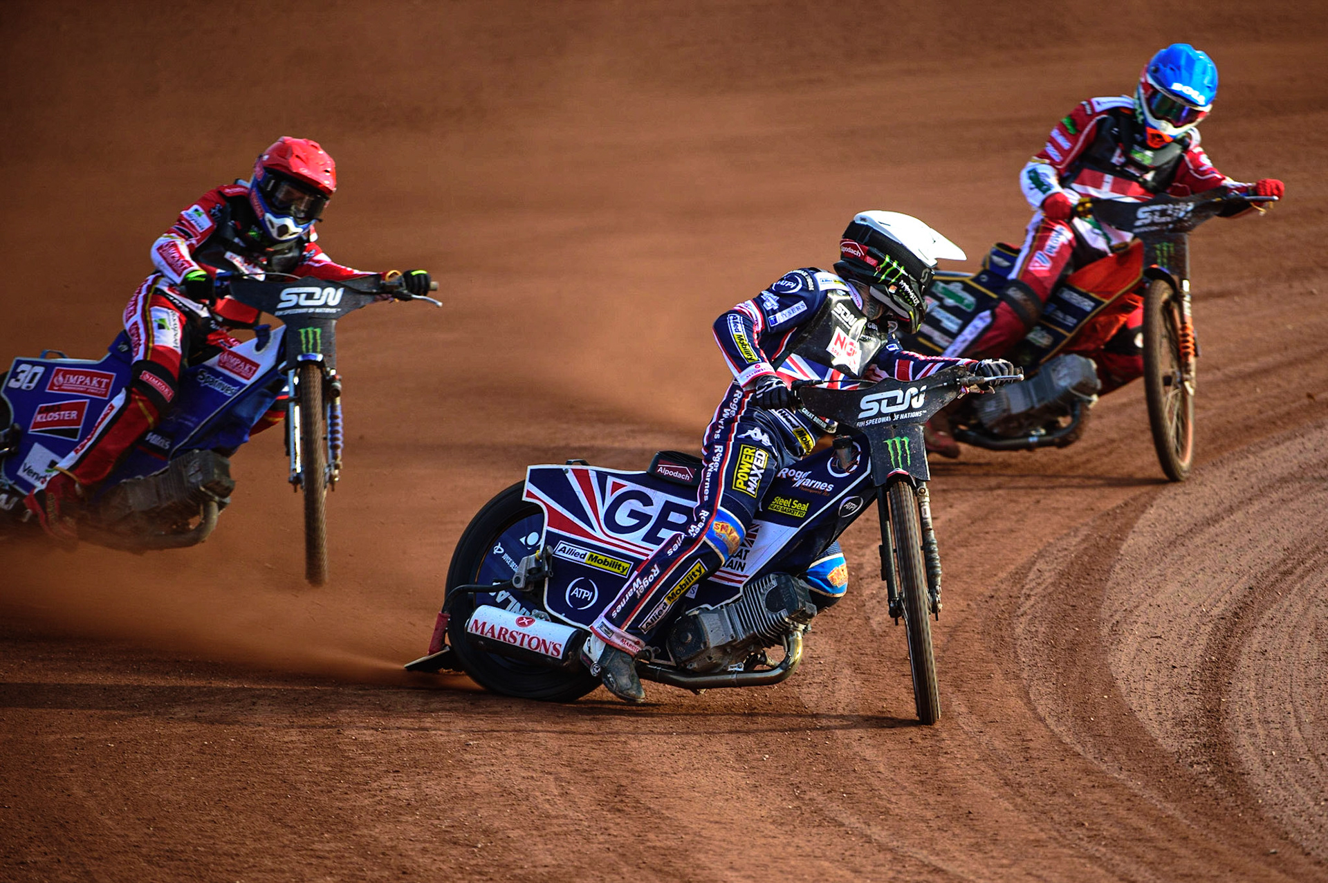 MANCHESTER, UK. OCT 16TH Tai Woffinden of Great Britain (White) leads Leon Madsen of Denmark (Red) and Mikkel Michelsen of Denmark (Blue) during the Monster Energy FIM Speedway of Nations at the National Speedway Stadium, Manchester on Saturday  16th October 2021. (Credit: Ian Charles | MI News)