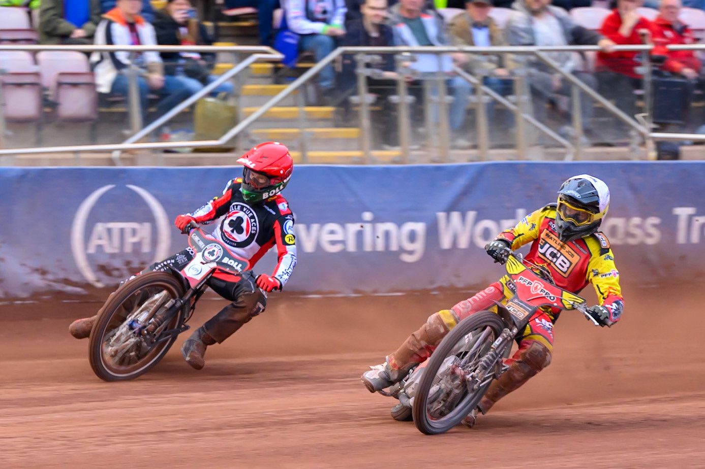 Ryan Douglas of Leicester Lions in White rides inside Brady Kurtz of Belle Vue Aces in Red during the Rowe Motor Oil Premiership match between Belle Vue Aces and Leicester Lions at the National Speedway Stadium, Manchester on Monday 15th June 2026. (Photo: Ian Charles | MI News)