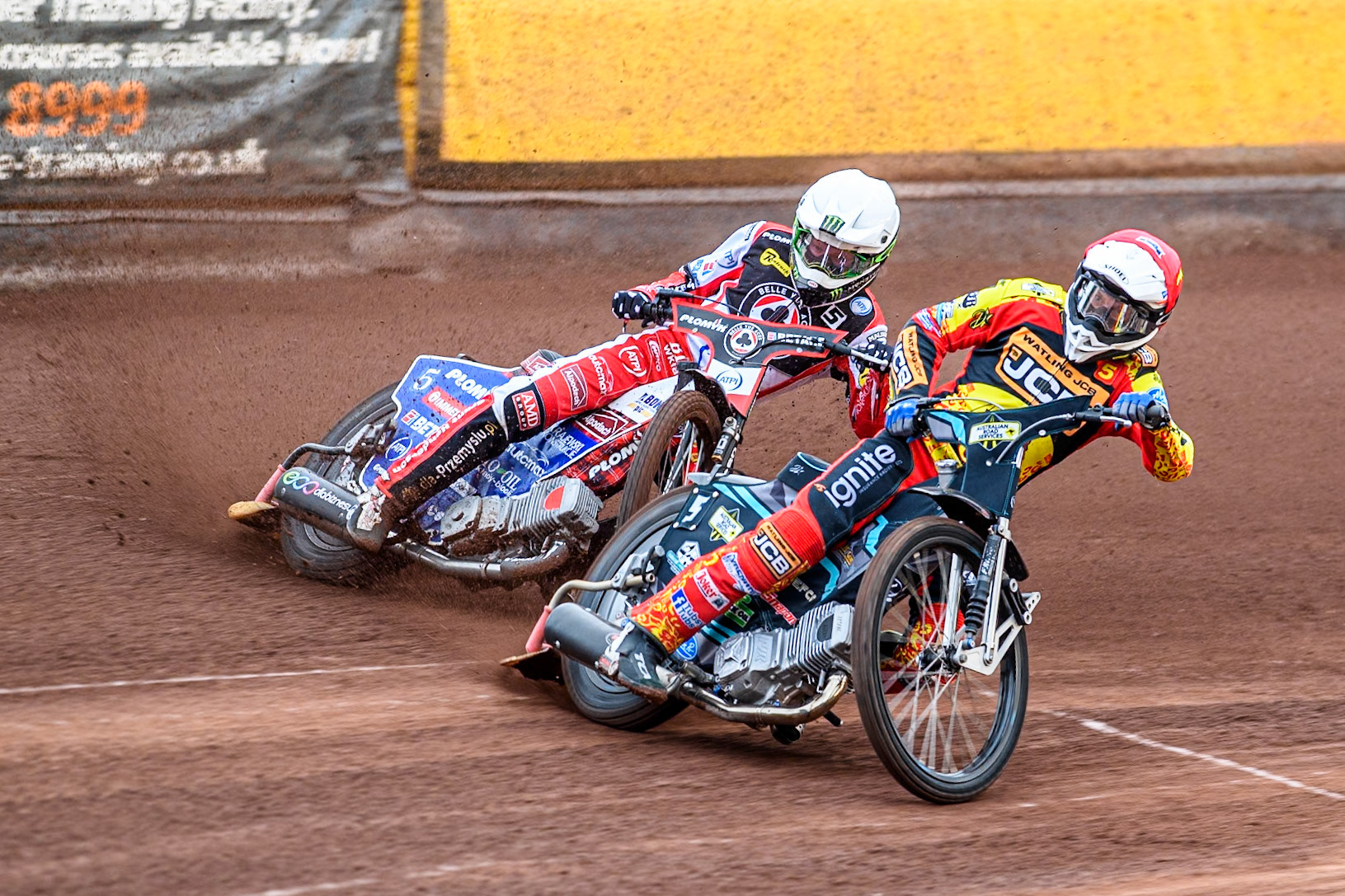 Leicester Lions' Ryan Douglas in Red leading Belle Vue Aces' Dan Bewley in White during the Rowe Motor Oil Premiership match between Leicester Lions and Belle Vue Aces at the Pidcock Motorcycles Arena, Leicester on Thursday 25th July 2024. (Photo: Ian Charles | MI News)