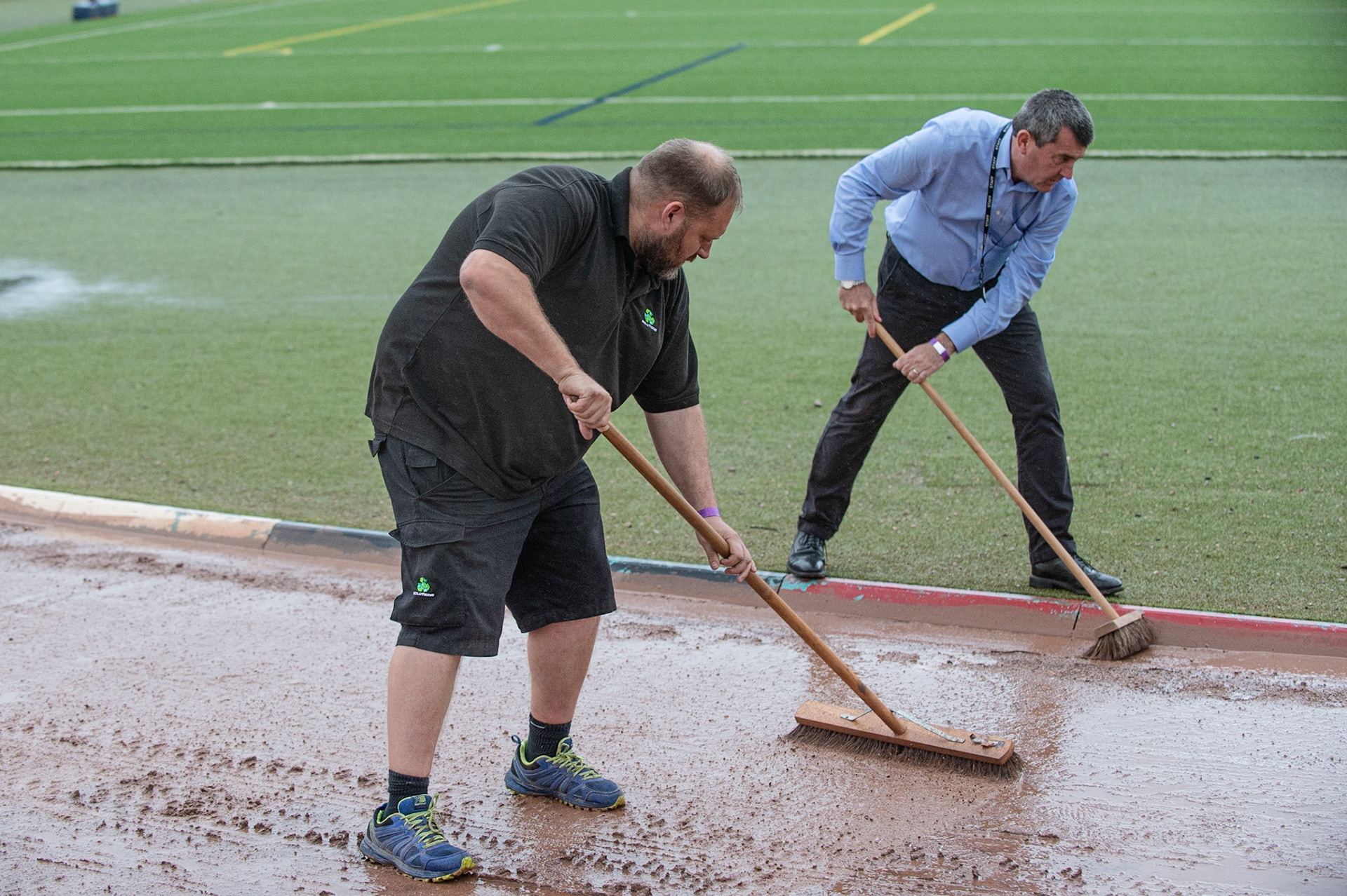 Photo: Ian Charles

Tony Bickley (Kyles father) (left) and Belle Vue CEO Adrian Smith help the track staff by brushing water off the track

Belle Vue Colts v Kent Kings, SGB National League, Belle Vue National Speedway Stadium, Manchester, Thursday 1  August  2019