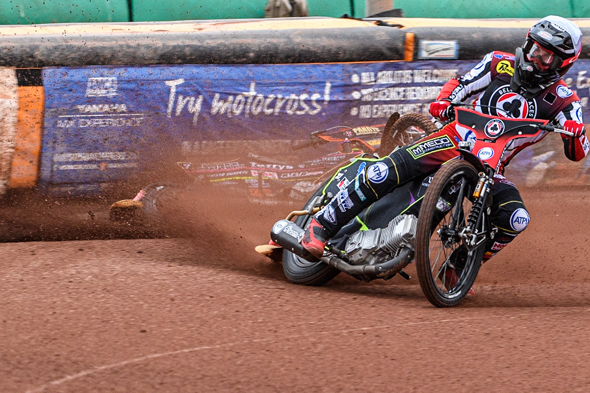Tom Brennan (White) inside Leon Flint (Blue) as he falls in the first bend during the Sports Insure Premiership match between Wolverhampton Wolves and Belle Vue Aces at Monmore Green Stadium, Wolverhampton on Monday 10th July 2023. (Photo: Ian Charles | MI News)