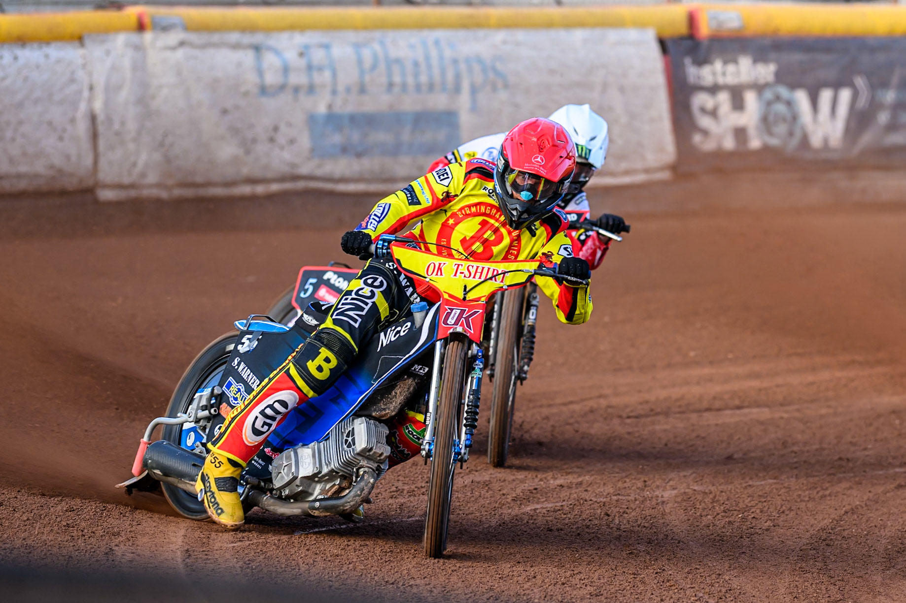 Birmingham Brummies' Matej Zagar  in Red leading Belle Vue Aces' Dan Bewley  in White during the Rowe Motor Oil Premiership match between Birmingham Brummies and Belle Vue Aces at Perry Barr Stadium, Birmingham on Monday 28th July 2025. (Photo: Ian Charles | MI News)