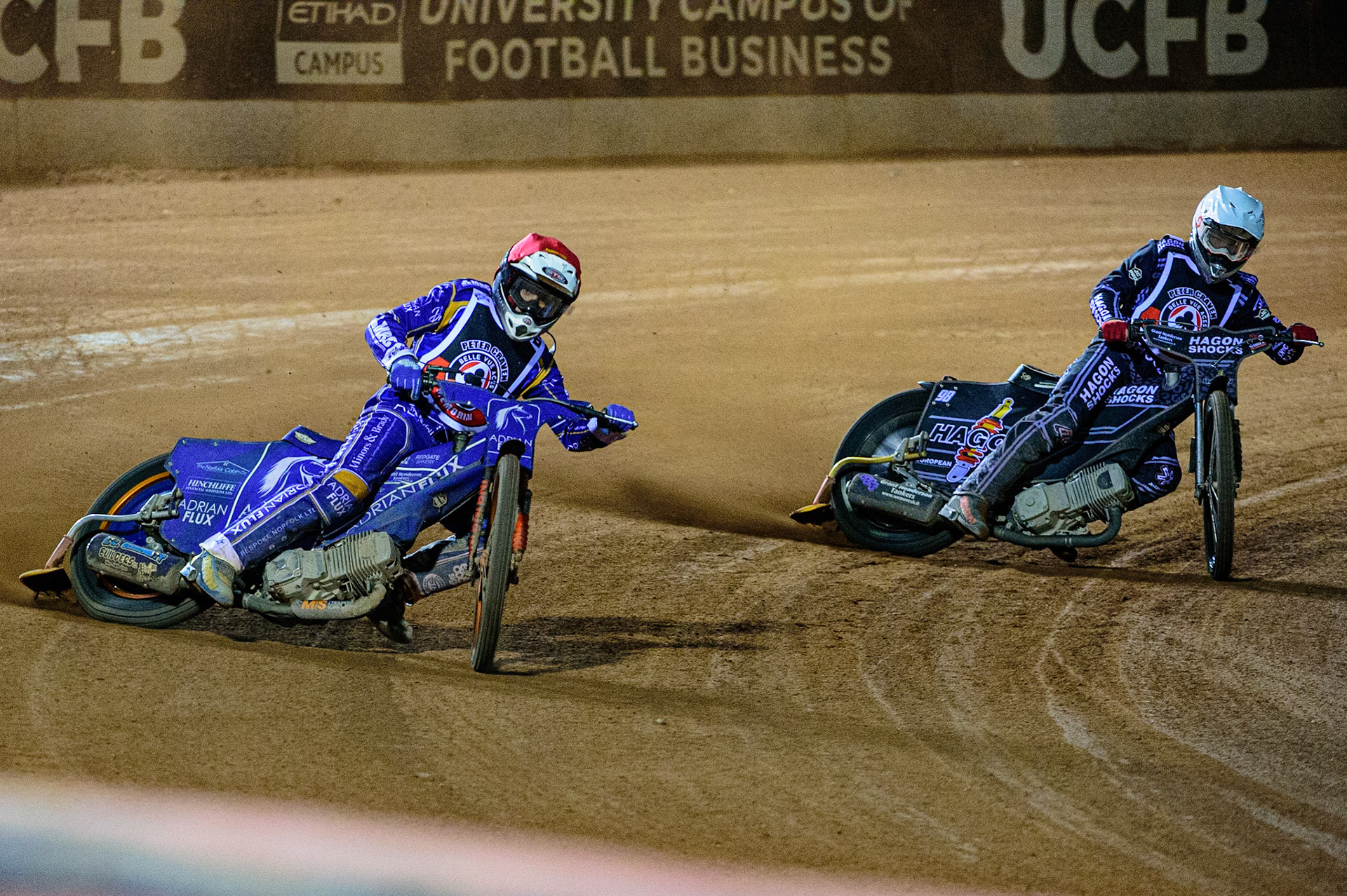 MANCHESTER, UK. OCT 23RD  Lewis Kerr  (Red) passes Broc Nicol  (White) during the Peter Craven Memorial Trophy event at the National Speedway Stadium, Manchester on Saturday 23rd October 2021. (Credit: Ian Charles | MI News)