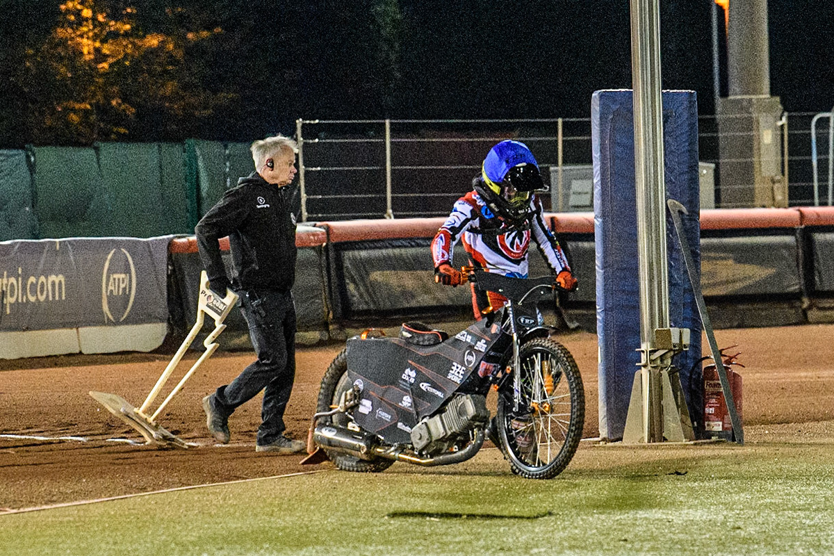 Jack Smith  pushes his bike off the track after an engine failure on the start line during the National Development League match between Belle Vue Colts and Oxford Chargers at the National Speedway Stadium, Manchester on Friday 12th May 2023. (Photo: Ian Charles | MI News)