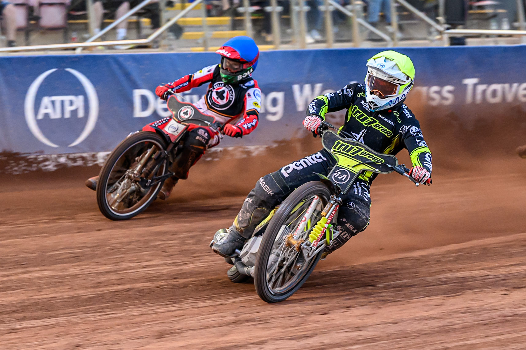 Ipswich Witches' Emil Saifutdinov  in Yellow rides inside Belle Vue Aces' Brady Kurtz  in Blue during the Rowe Motor Oil Premiership match between Belle Vue Aces and Ipswich Witches at the National Speedway Stadium, Manchester on Monday 30th June 2025. (Photo: Ian Charles | MI News)