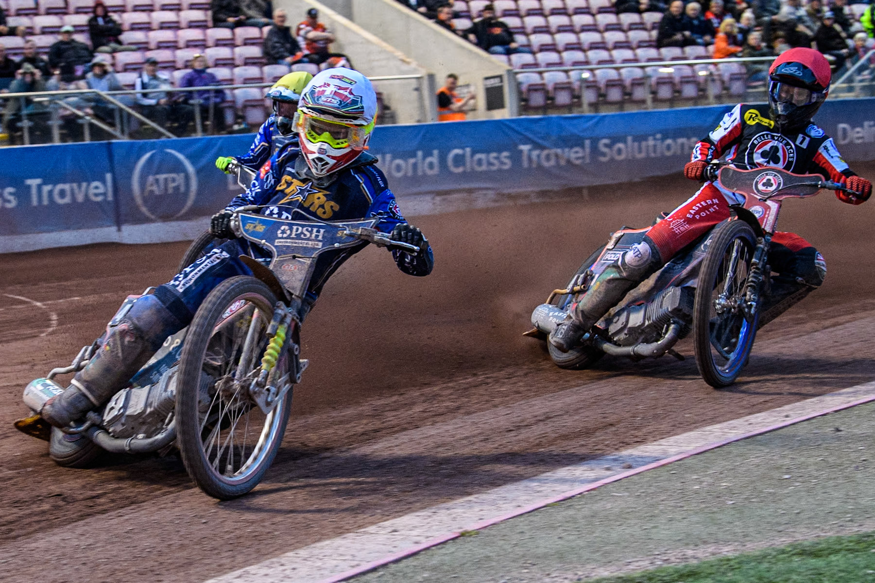 King Lynn Stars' Michael Palm Toft in White leading King Lynn Stars' Nicolai Klindt in Yellow and Belle Vue Aces' Brady Kurtz in Red during the Rowe Motor Oil Premiership match between Belle Vue Aces and King's Lynn Stars at the National Speedway Stadium, Manchester on Monday 20th May 2024. (Photo: Ian Charles | MI News)
