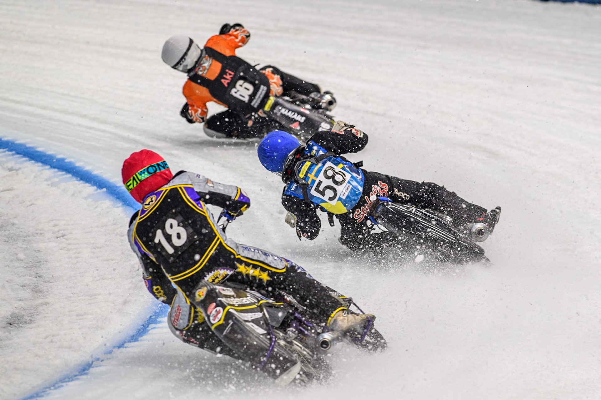 Germany's Christoph Kirchner (18) (Red) chases Sweden's Stefan Svensson (58) (Blue) and Finland's Aki Ala-Riihimäki (66) (White) during the FIM Ice Speedway Gladiators World Championship Final 2 at the Max-Aicher-Arena, Inzell on Sunday 24 March 2024. (Photo: Ian Charles | MI News)
