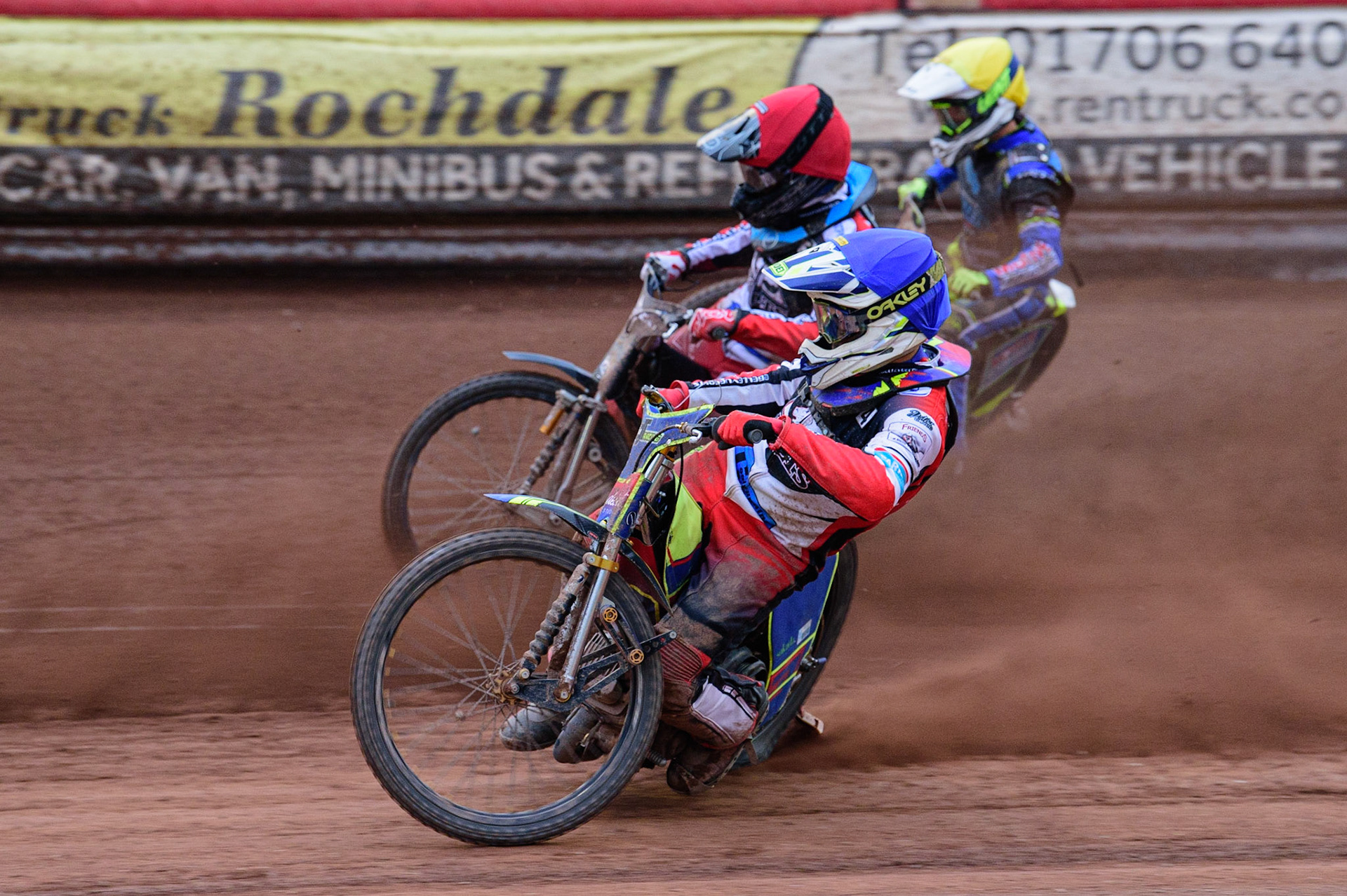 MANCHESTER, UK. JUN 24TH  Nathan Ablitt  (Blue) inside Harry McGurk  (Red) and Ben Rathbone (Yellow) during the National Development League match between Belle Vue Colts and Berwick Bullets at the National Speedway Stadium, Manchester on Friday 24th June 2022. (Credit: Ian Charles | MI News)