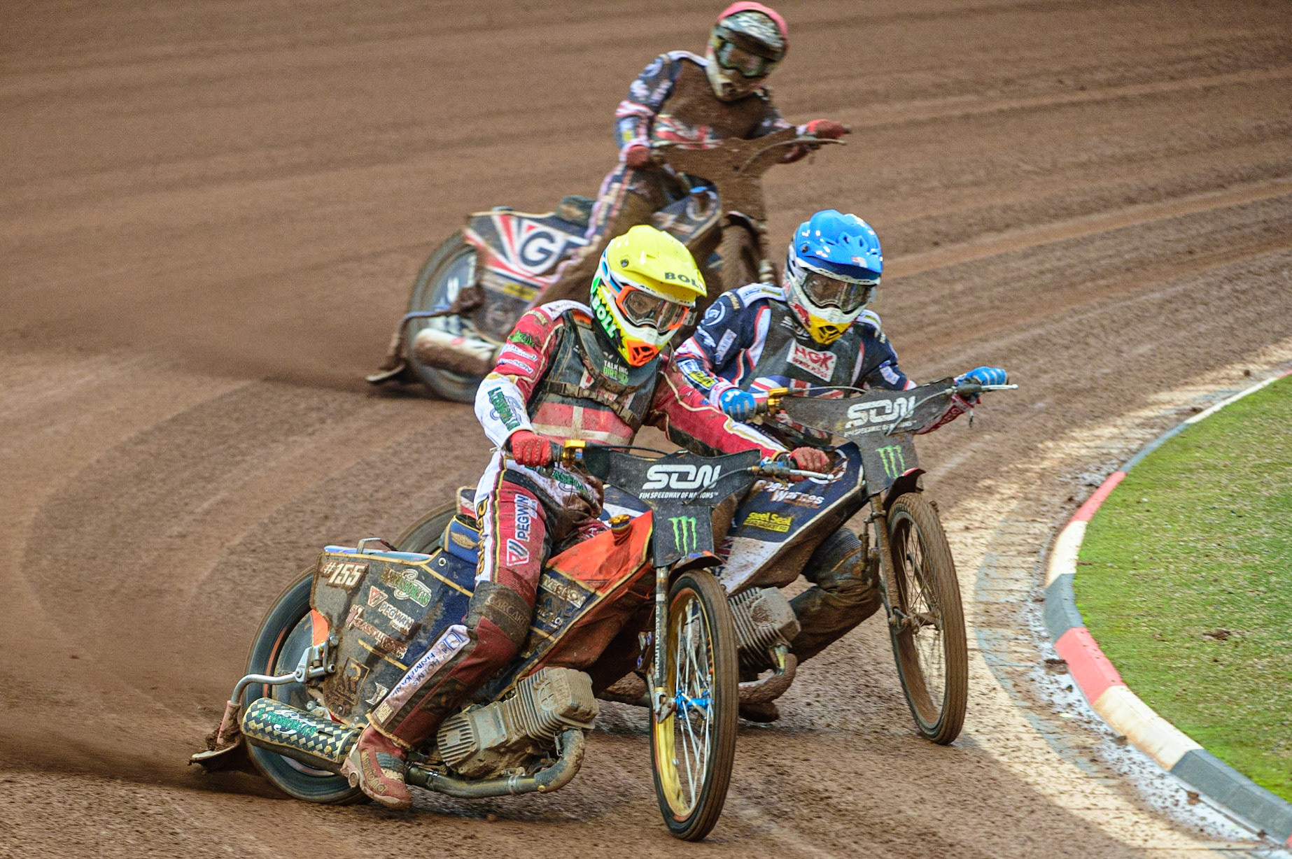 MANCHESTER, UK. OCT 17TH Mikkel Michelsen of Denmark (Yellow) leads Robert Lambert of Great Britain (Blue) and Dan Bewley of Great Britain (Red) during the Monster Energy FIM Speedway of Nations at the National Speedway Stadium, Manchester on Sunday  17th October 2021. (Credit: Ian Charles | MI News)