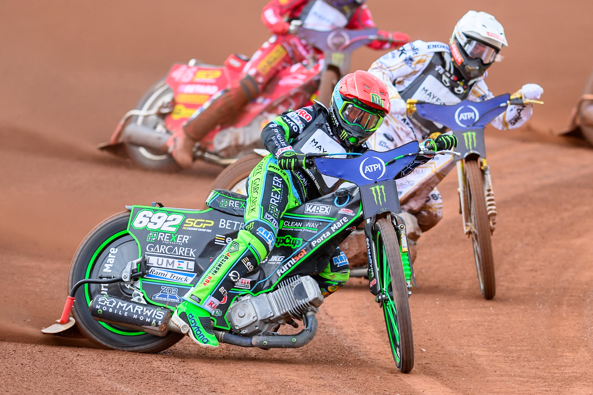 Patryk Dudek (692) of Poland in Red leading Anders Thomsen (105) of Denmark in White during the ATPI  FIM Speedway GP of Manchester at the National Speedway Stadium, Manchester on Friday 5th June 2026. (Photo: Ian Charles | MI News)