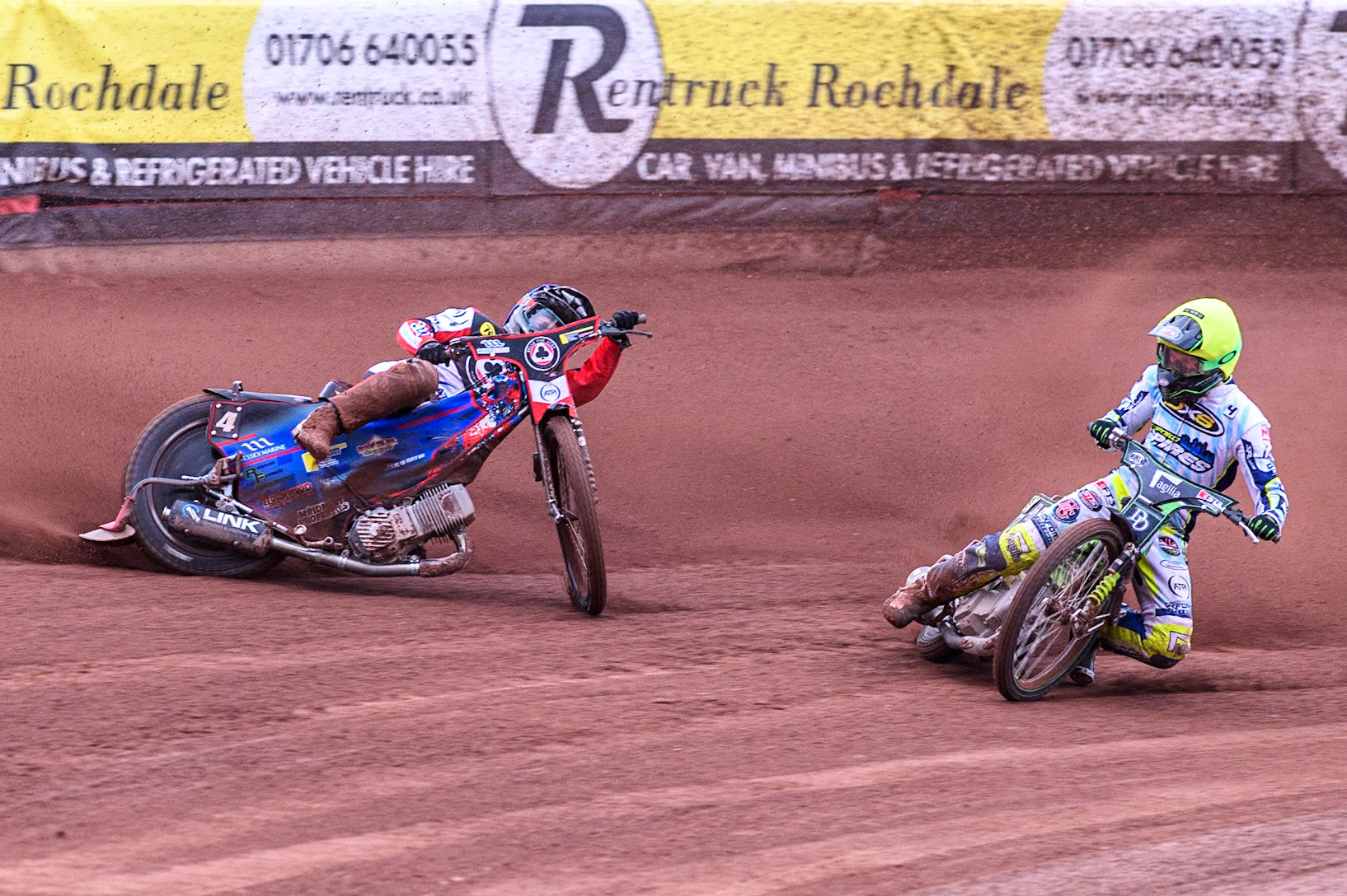 Belle Vue Aces' Ben Cook in Blue loses control after a tangle with Oxford Spires' Charles Wright in Yellow during the Rowe Motor Oil Premiership match between Belle Vue Aces and Oxford Spires at the National Speedway Stadium, Manchester on Monday 22nd July 2024. (Photo: Ian Charles | MI News)