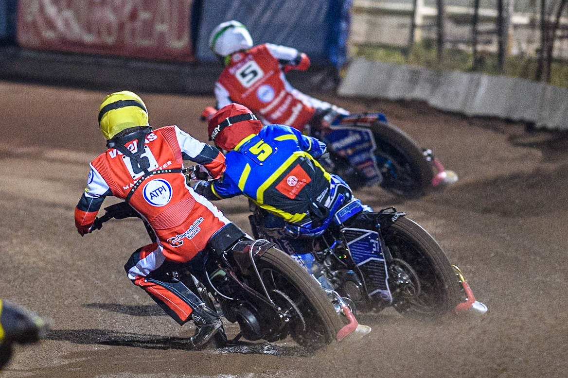 Belle Vue Aces' Antti Vuolas  in Yellow is passed by Sheffield Tigers' Guest Rider Chris Harris  in Red with Belle Vue Aces' Dan Bewley  in White leading during the Rowe Motor Oil Premiership Play Off Semi Final 2nd leg between Sheffield Tigers and Belle Vue Aces at Owlerton Stadium, Sheffield on Thursday 19th September 2024. (Photo: Ian Charles | MI News)