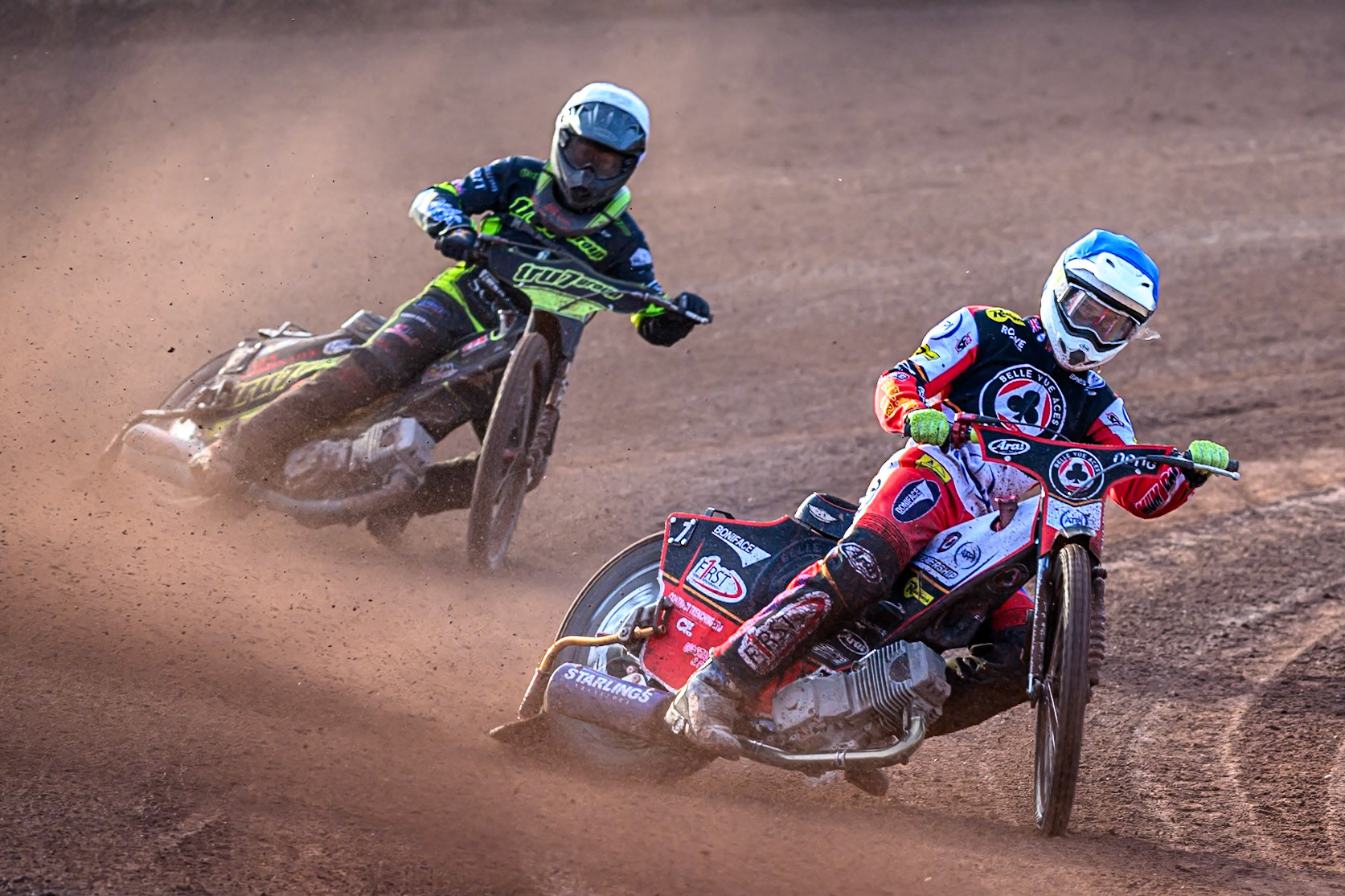 Belle Vue Aces' Jake Mulford  in Blue leading Ipswich Witches' Dan Thompson  in White during the Rowe Motor Oil Premiership match between Belle Vue Aces and Ipswich Witches at the National Speedway Stadium, Manchester on Monday 30th June 2025. (Photo: Ian Charles | MI News)