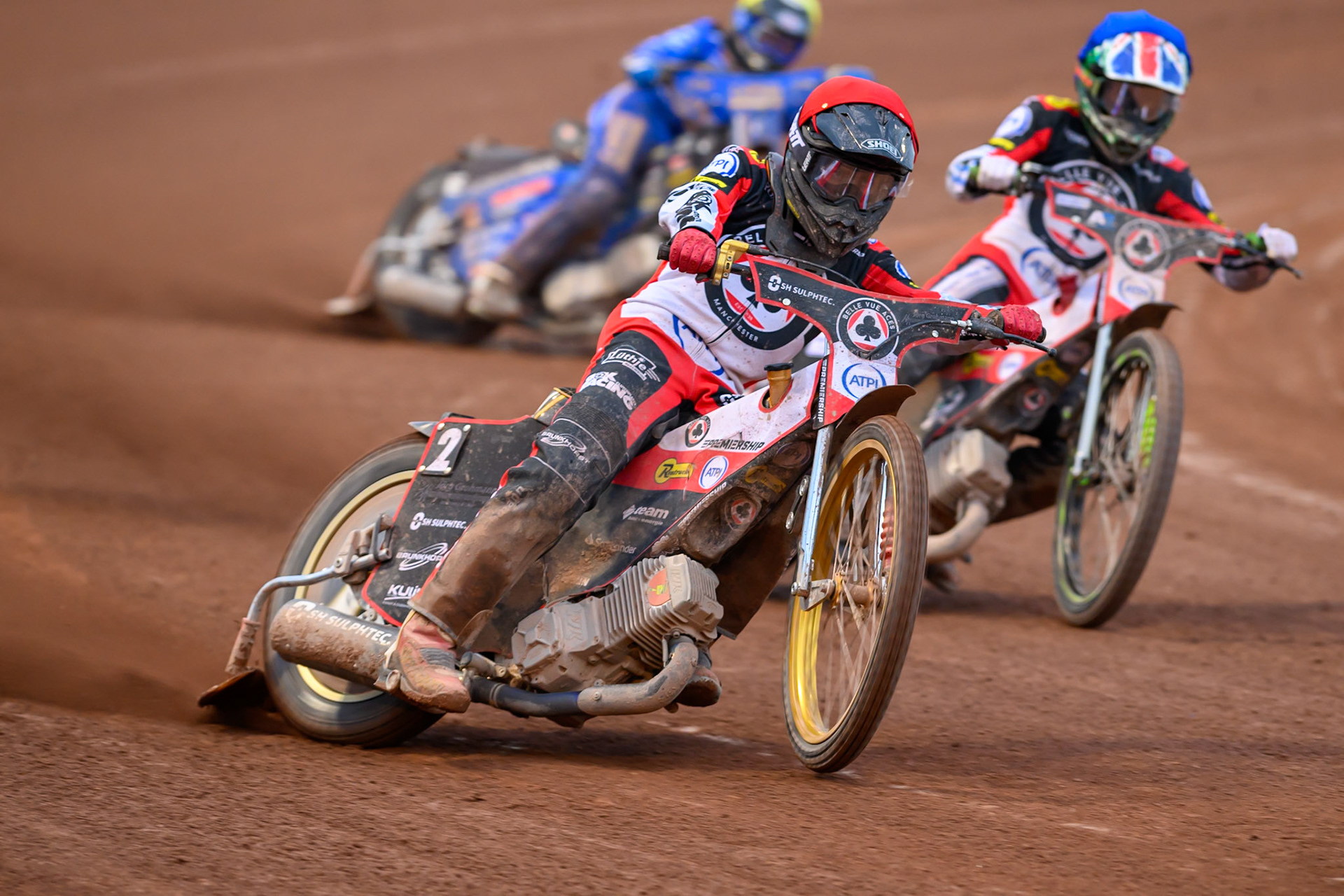 Norick Blödorn of Belle Vue Aces in Red leading  William Cairns of Belle Vue Aces in Blue and Jody Scott of Kings Lynn Stars in Yellow during the Rowe Motor Oil Premiership match between Belle Vue Aces and King's Lynn Stars at the National Speedway Stadium, Manchester on Monday 29th June 2026. (Photo: Ian Charles | MI News)