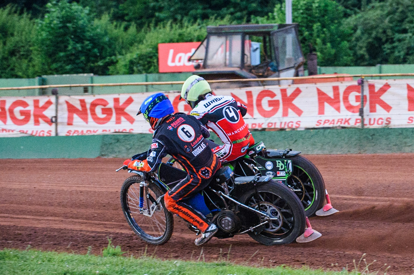 WOLVERHAMPTON, UK. JULY 26TH Ryan Douglas  (Blue) chases Charles Wright (Yellow) during the SGB Premiership match between Wolverhampton Wolves and Belle Vue Aces at the Ladbroke Stadium, Wolverhampton on Monday 26th July 2021. (Credit: Ian Charles | MI News)