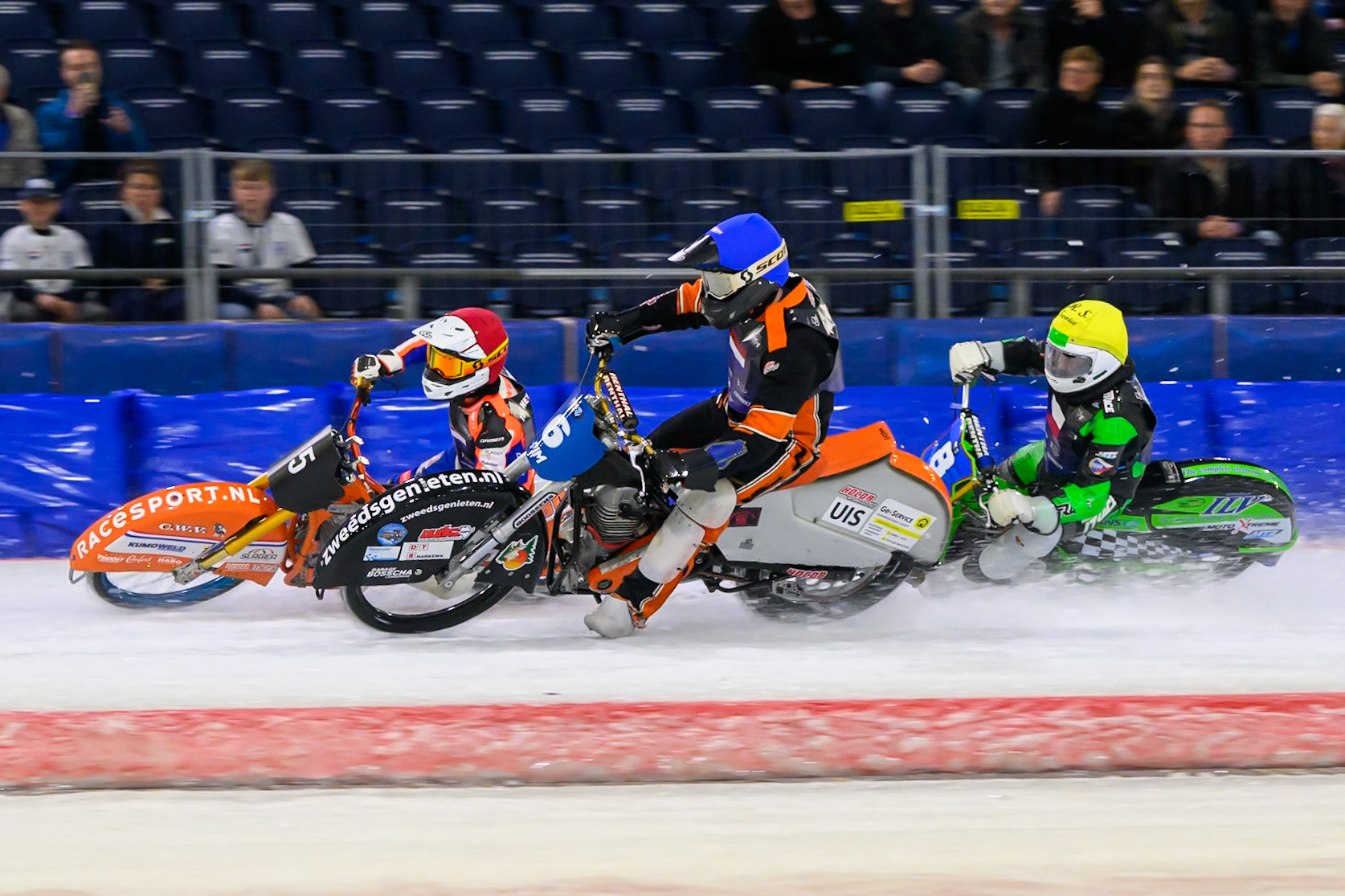 Sebastian Reitsma (6) of The Netherlands  in Blue and Jasper Iwema (5) of The Netherlands  in Red hold back Andrej Diviš (8) of Czechia  in Yellow during the FIM Ice Speedway Of Nations at Ice Rink Thialf, Heerenveen on Sunday 12th April 2026. (Photo: Ian Charles | MI News)