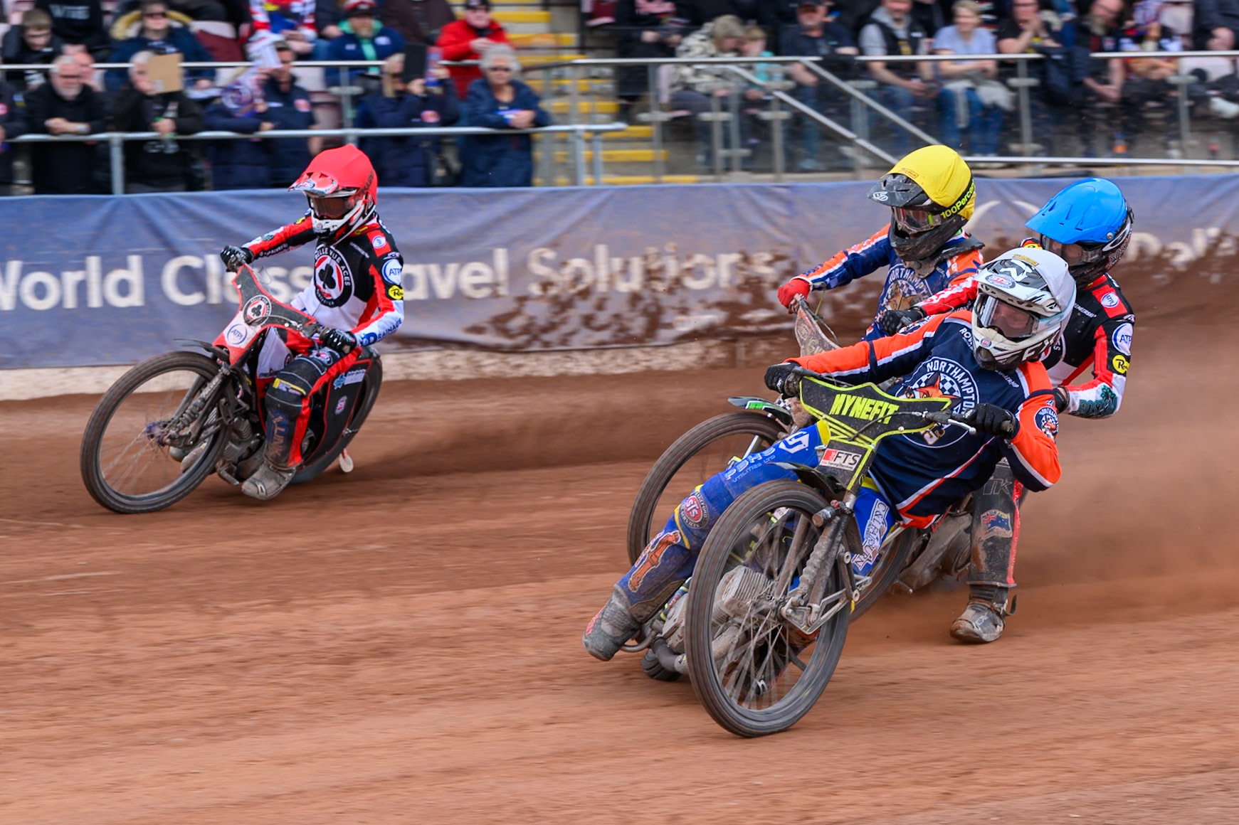 Jye Etheridge, Guest Rider for Northampton Foxes in White rides inside Zach Cook of Belle Vue Aces in Red with Tate Zischke of Belle Vue Aces in Blueand Luke Harrison of Northampton Foxes in Yellow behind  during the Rowe Motor Oil Premiership match between Belle Vue Aces and Northampton Foxes at the National Speedway Stadium, Manchester on Monday 4th May 2026. (Photo: Ian Charles | MI News)