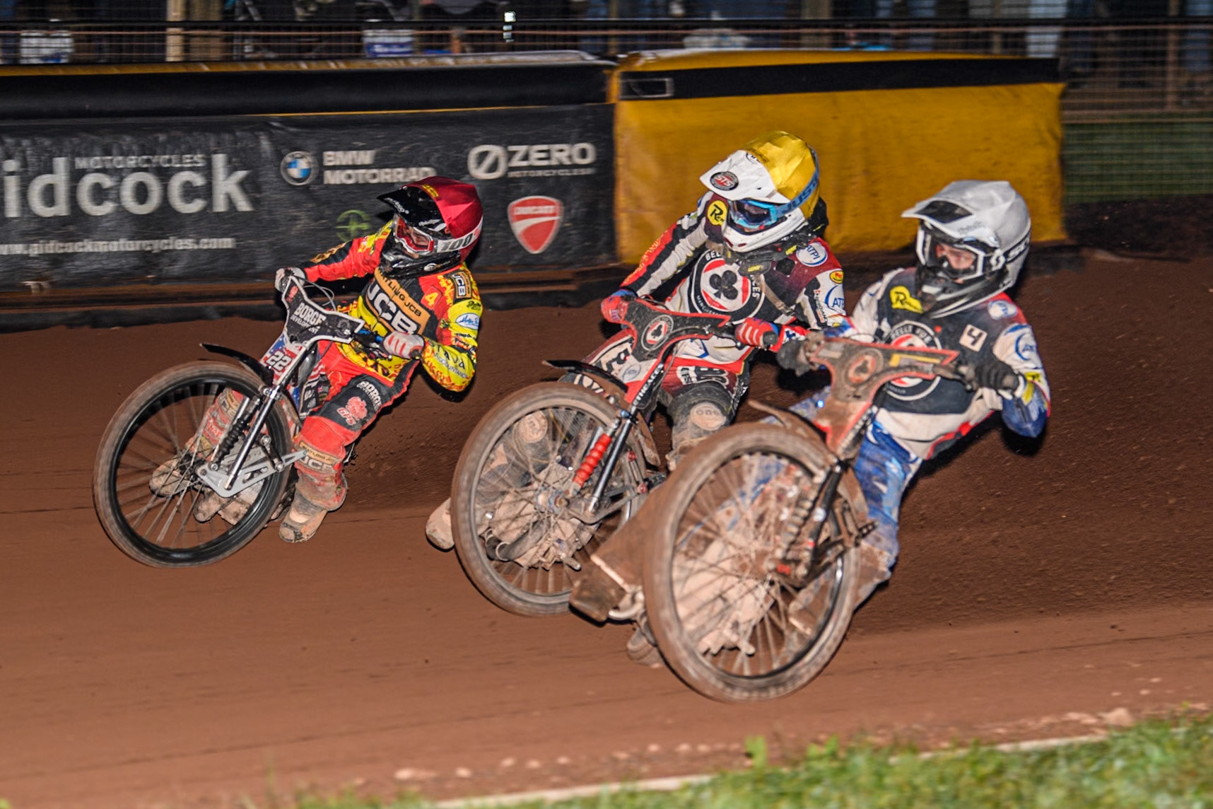 Belle Vue Aces' Ben Cook in White rides inside Belle Vue Aces' Jake Mulford in Yellow and Leicester Lions' Luke Becker in Red during the Rowe Motor Oil Premiership Grand Final 2nd Leg between Leicester Lions and Belle Vue Aces at the Pidcock Motorcycles Arena, Leicester on Thursday 26th September 2024. (Photo: Ian Charles | MI News)