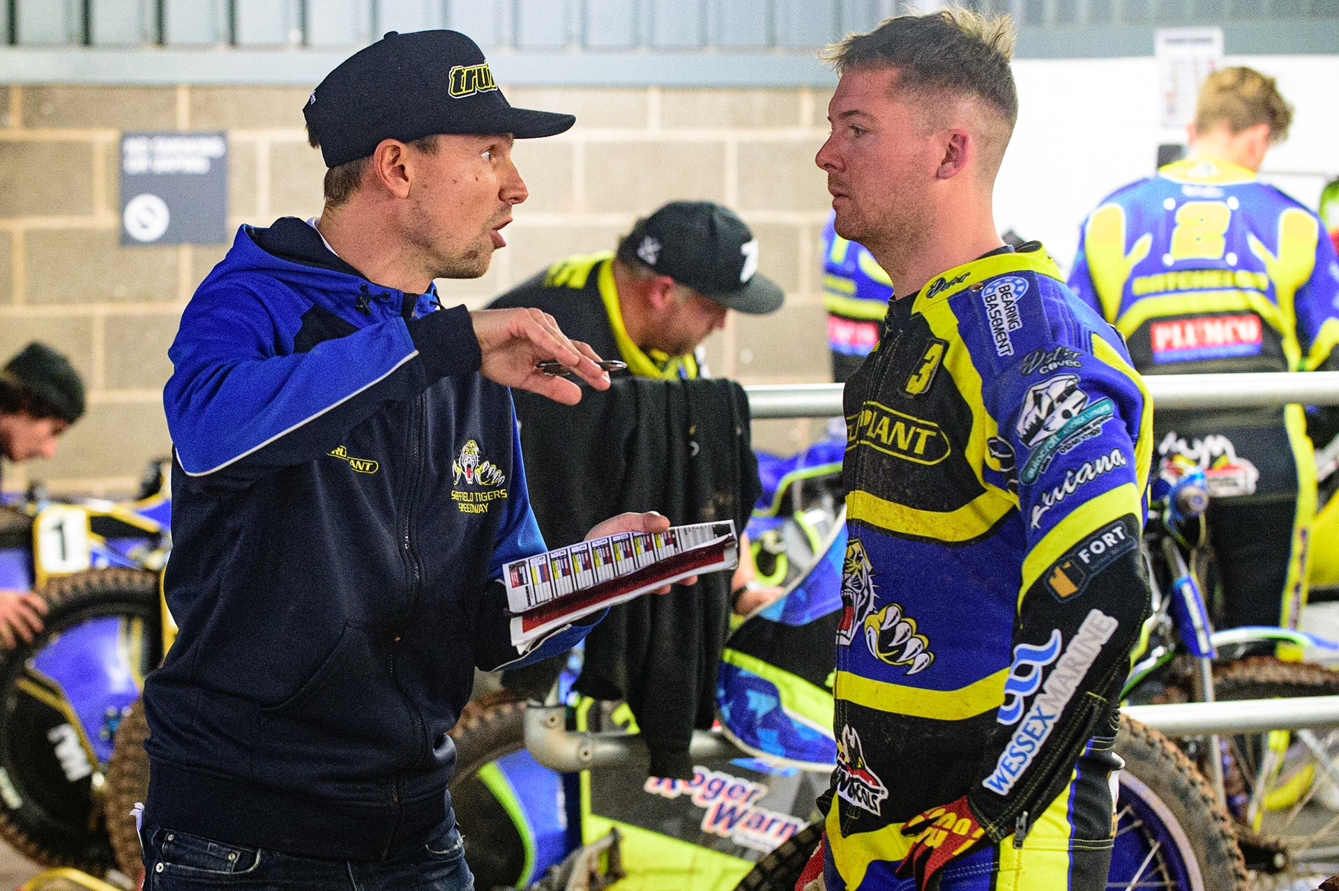 MANCHESTER, UK. OCT 7TH  Sheffield TruPlant Tigers  manager Simon Stead (left)  with Kyle Howarth planning their next move during the SGB Premiership Play off Semi-Final Second Leg between Belle Vue Aces and Sheffield Tigers at the National Speedway Stadium, Manchester on Thursday 7th October 2021. (Credit: Ian Charles | MI News)