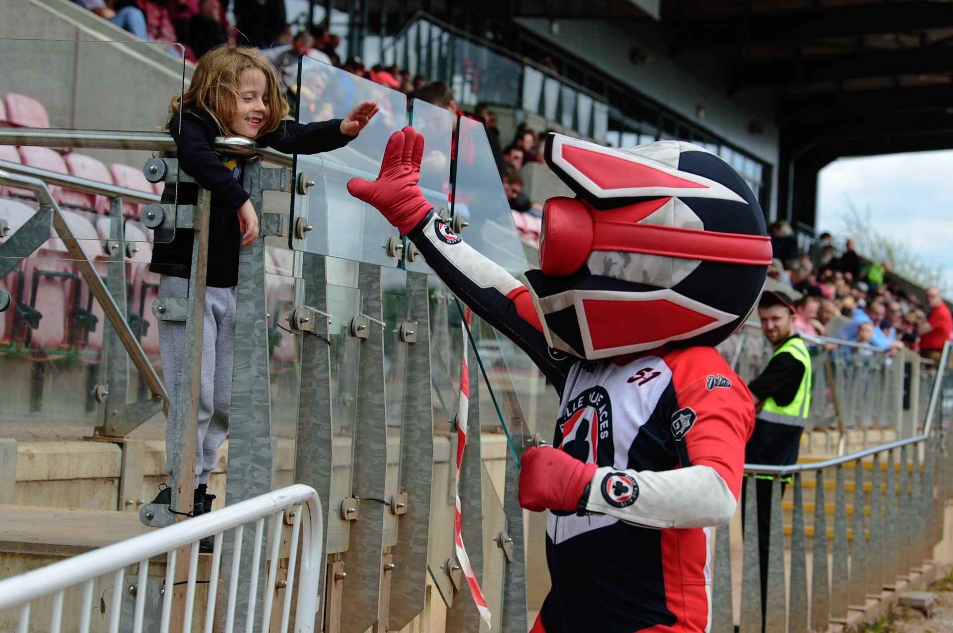 MANCHESTER, UK. APR 15TH  Belle Vue Mascot Chase The Ace with a fan  during the National Development League match between Belle Vue Colts and Plymouth Centurions at the National Speedway Stadium, Manchester on Friday 15th April 2022. (Credit: Ian Charles | MI News)