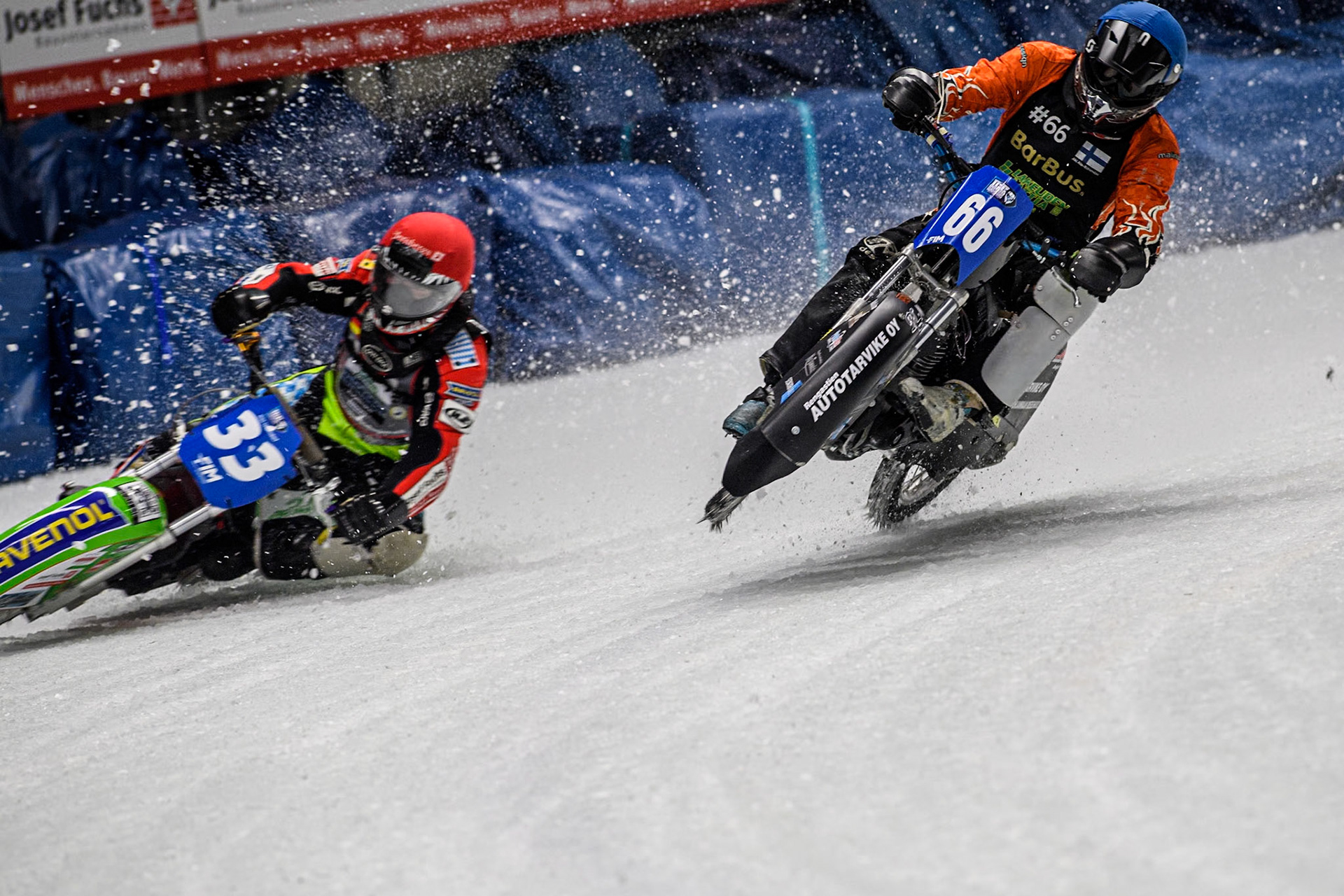 Finland's Aki Ala-Riihimäki (66) (Blue) gets into difficulty as he challenges Germany's Johann Weber (33) (Red) during the FIM Ice Speedway Gladiators World Championship Final 1 at the Max-Aicher-Arena, Inzell on Saturday 23 March 2024. (Photo: Ian Charles | MI News)