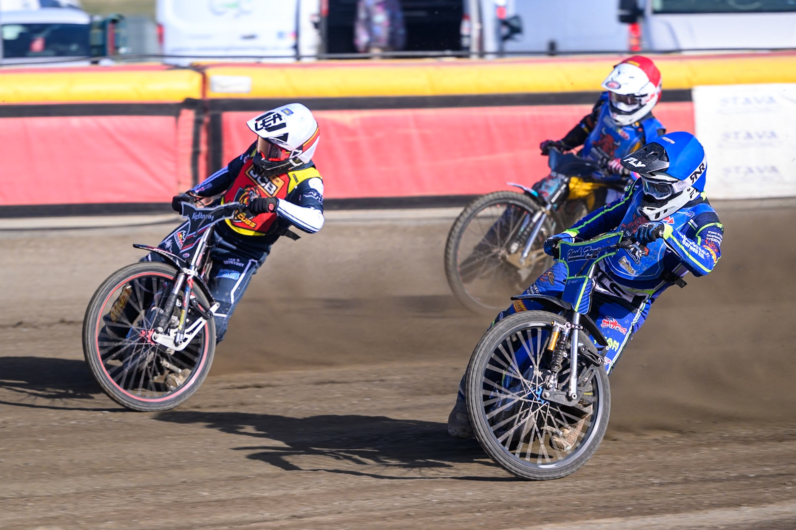 Arran Butcher of Buxton Bulls   in Blue on the inside of Ben Morley of Leicester Lion Cubs  in White  with Alfie Bowtell of Buxton Bulls  in Red  behind during the WSRA National Development League match between Buxton Bulls and Leicester Lion Cubs at Hi-Edge Speedway, Buxton on Sunday 4th October 2026. (Photo: Ian Charles | MI News)