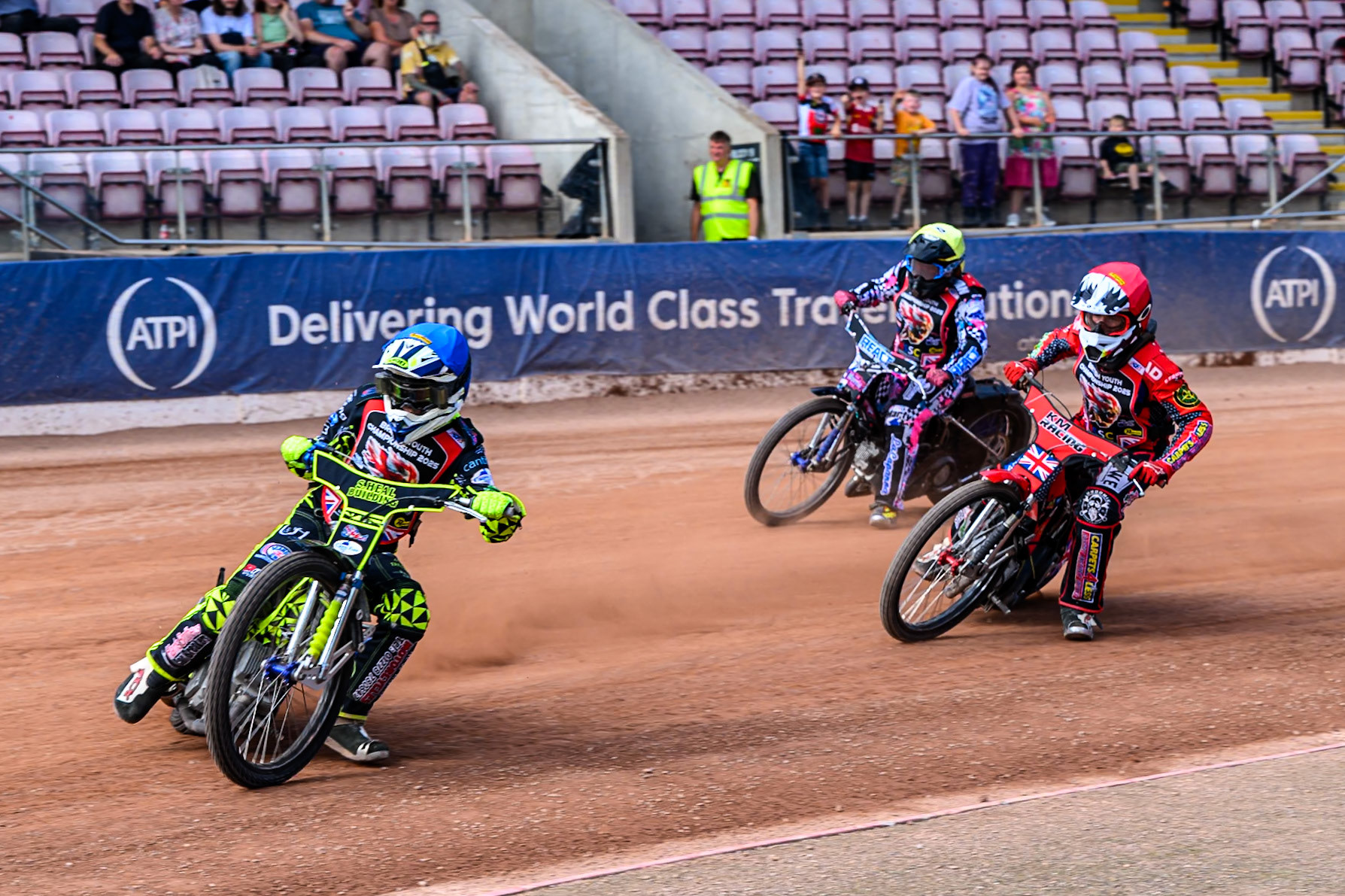 Oli Boverton (15) in Blue leading Kayden Mundy (8) in Red and Liam Morris (21) in Yellow during the British Youth Speedway Championship at the National Speedway Stadium, Manchester on Sunday 10th August 2025. (Photo: Ian Charles | MI News)