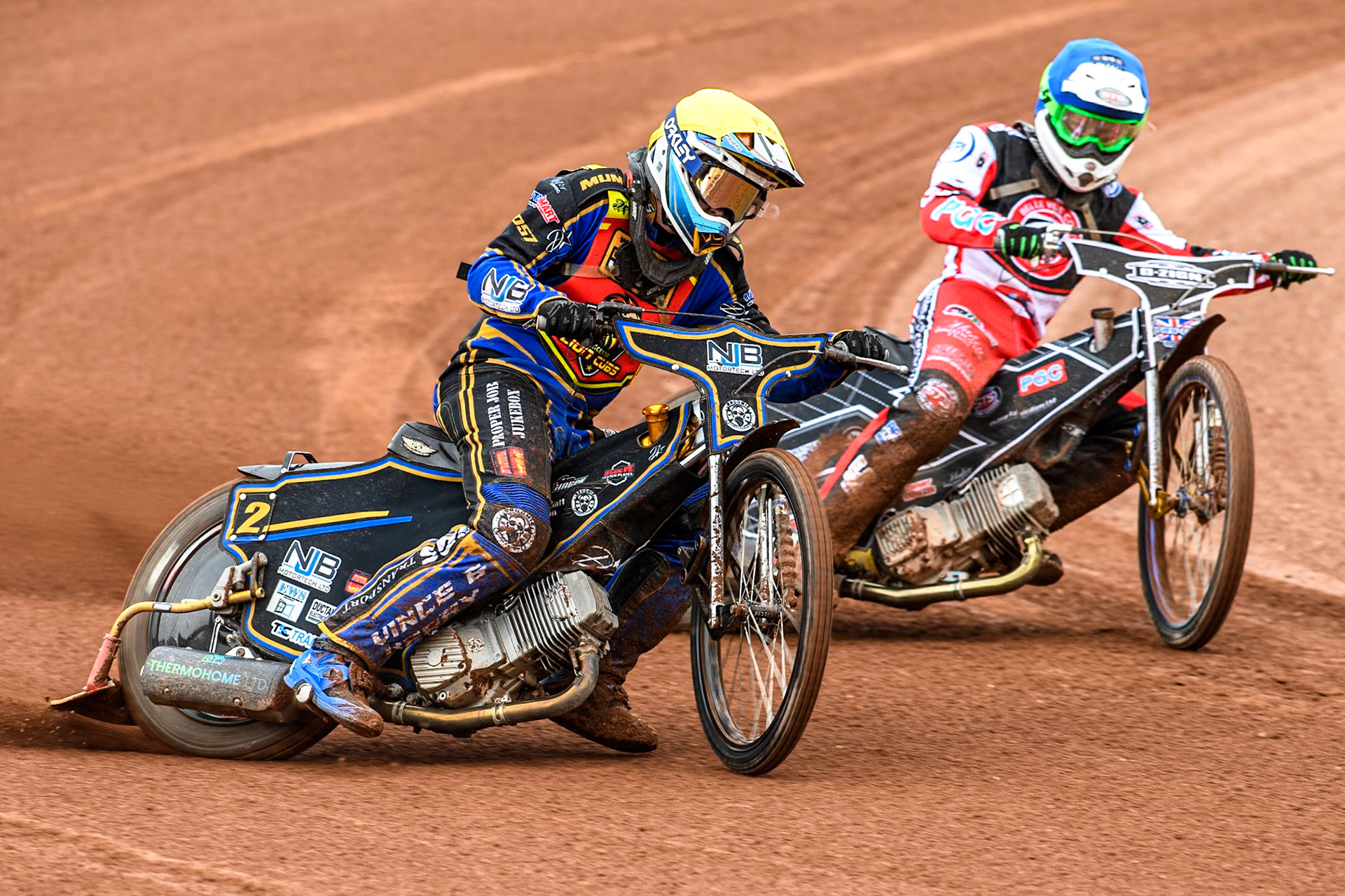 Leicester Lion Cubs' Eli Meadows  in Yellow rides outside Belle Vue Colts' Jack Shimelt  in Blue during the WSRA National Development League match between Belle Vue Colts and Leicester Lion Cubs at the National Speedway Stadium, Manchester on Friday 18th April 2025. (Photo: Ian Charles | MI News)