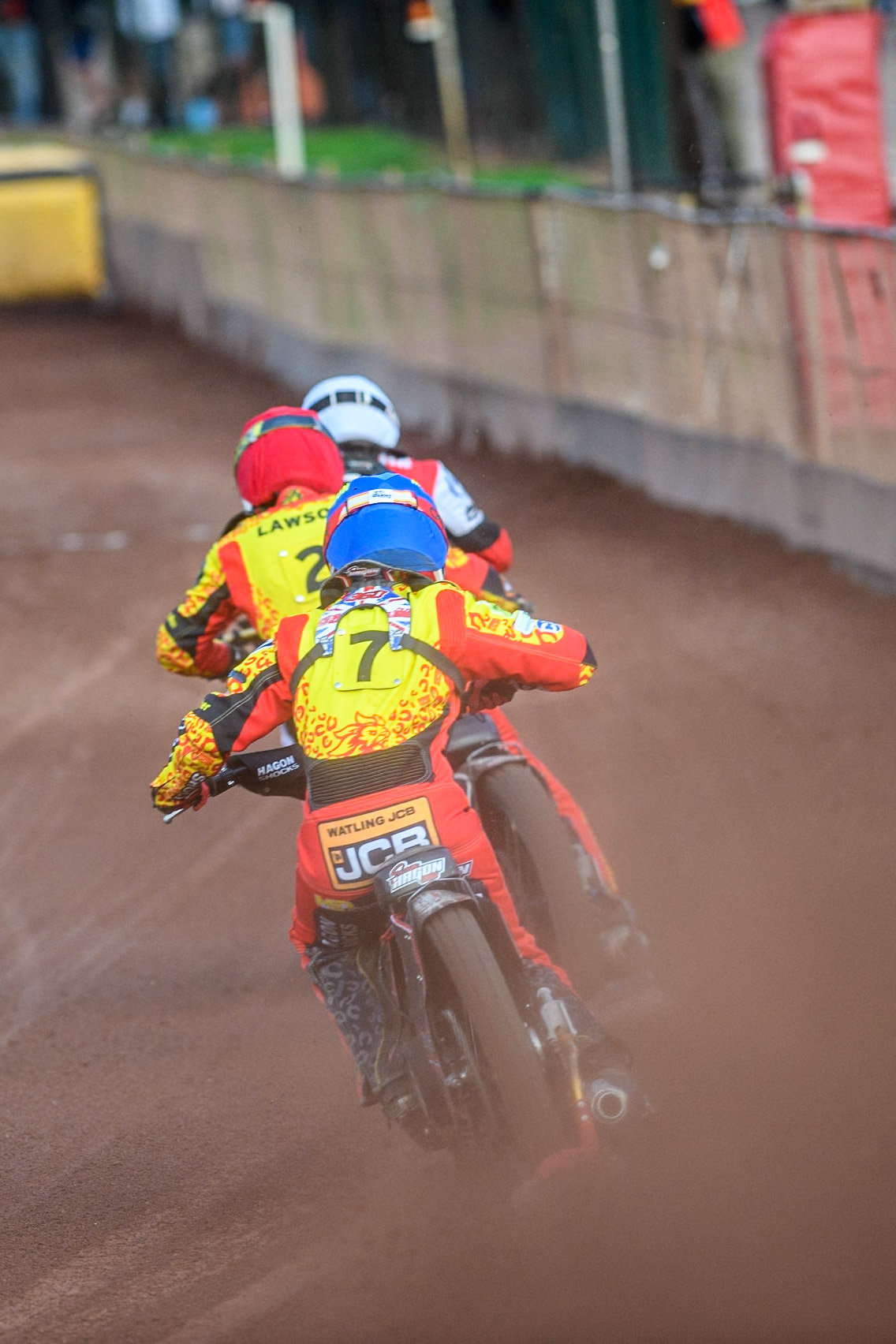 Leicester Lions' Sam Hagon in Blue chases Leicester Lions' Richard Lawson in Red and Belle Vue Aces' Norick Blodorn in White during the Rowe Motor Oil Premiership match between Leicester Lions and Belle Vue Aces at the Pidcock Motorcycles Arena, Leicester on Thursday 25th July 2024. (Photo: Ian Charles | MI News)