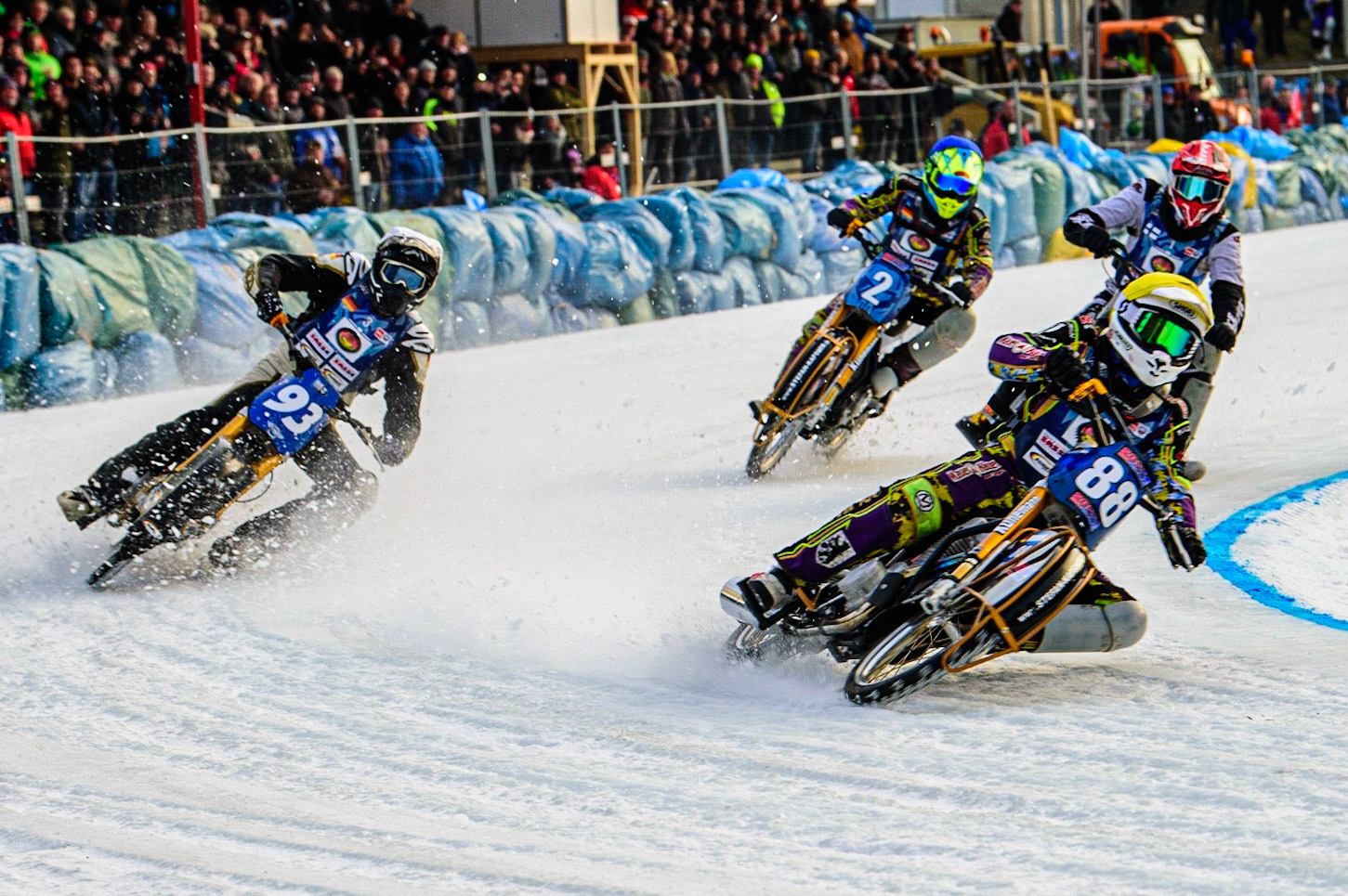 Max Neidermaier (Yellow) leads Franz Mayerbüchler (White), Maximillian Neidermaier (Blue) and Atte Suolami (Red) into the first turnduring the German Individual Ice Speedway Championship at Horst-Dohm-Eisstadion, Berlin on Friday 3rd March 2023. (Photo: Ian Charles | MI News)