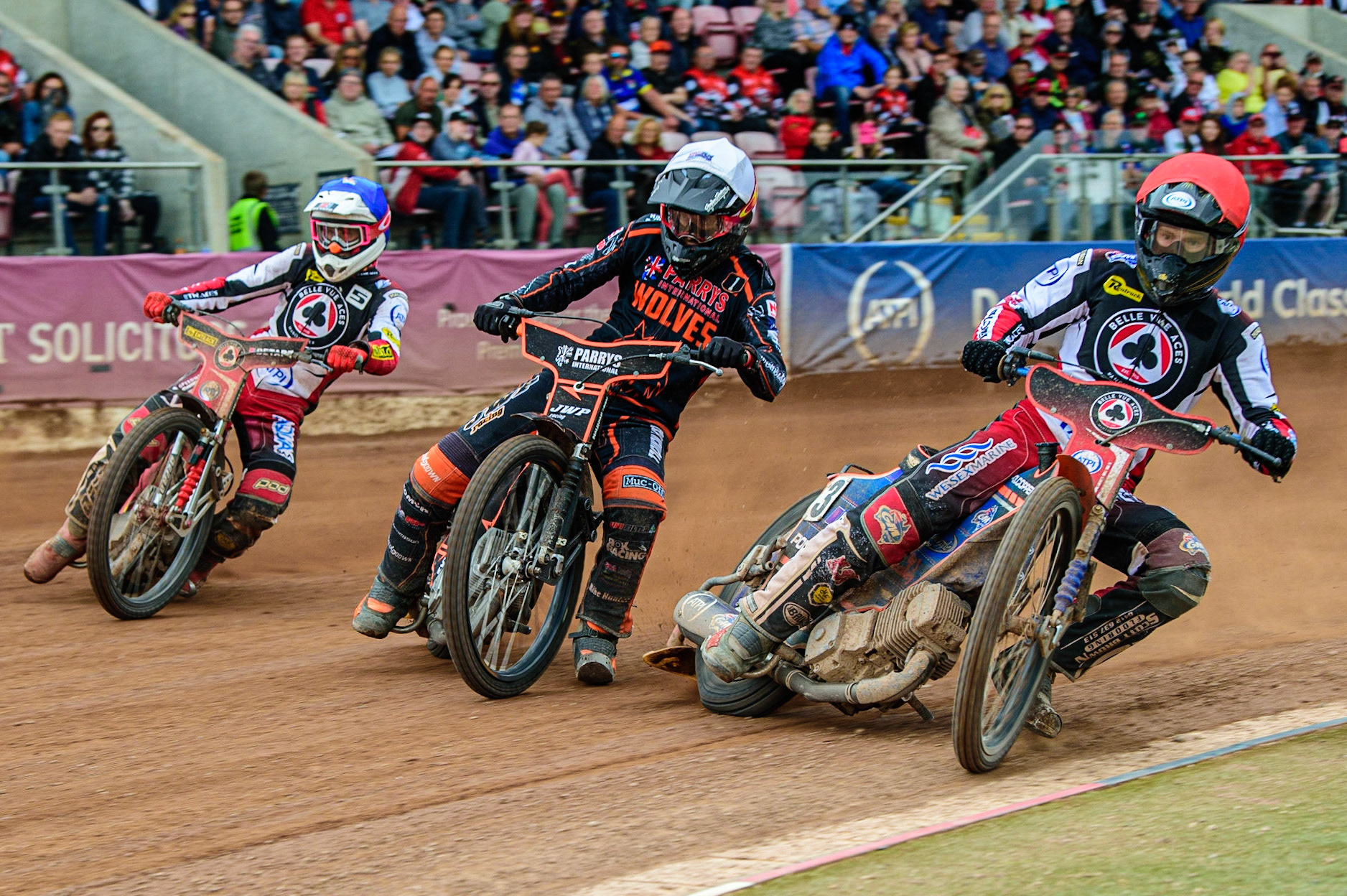 Brady Kurtz  (Red) inside Sam Masters  (White) and Max Fricke  (Blue) during the SGB Premiership match between Belle Vue Aces and Wolverhampton Wolves at the National Speedway Stadium, Manchester on Monday 29th August 2022. (Credit: Ian Charles | MI News)