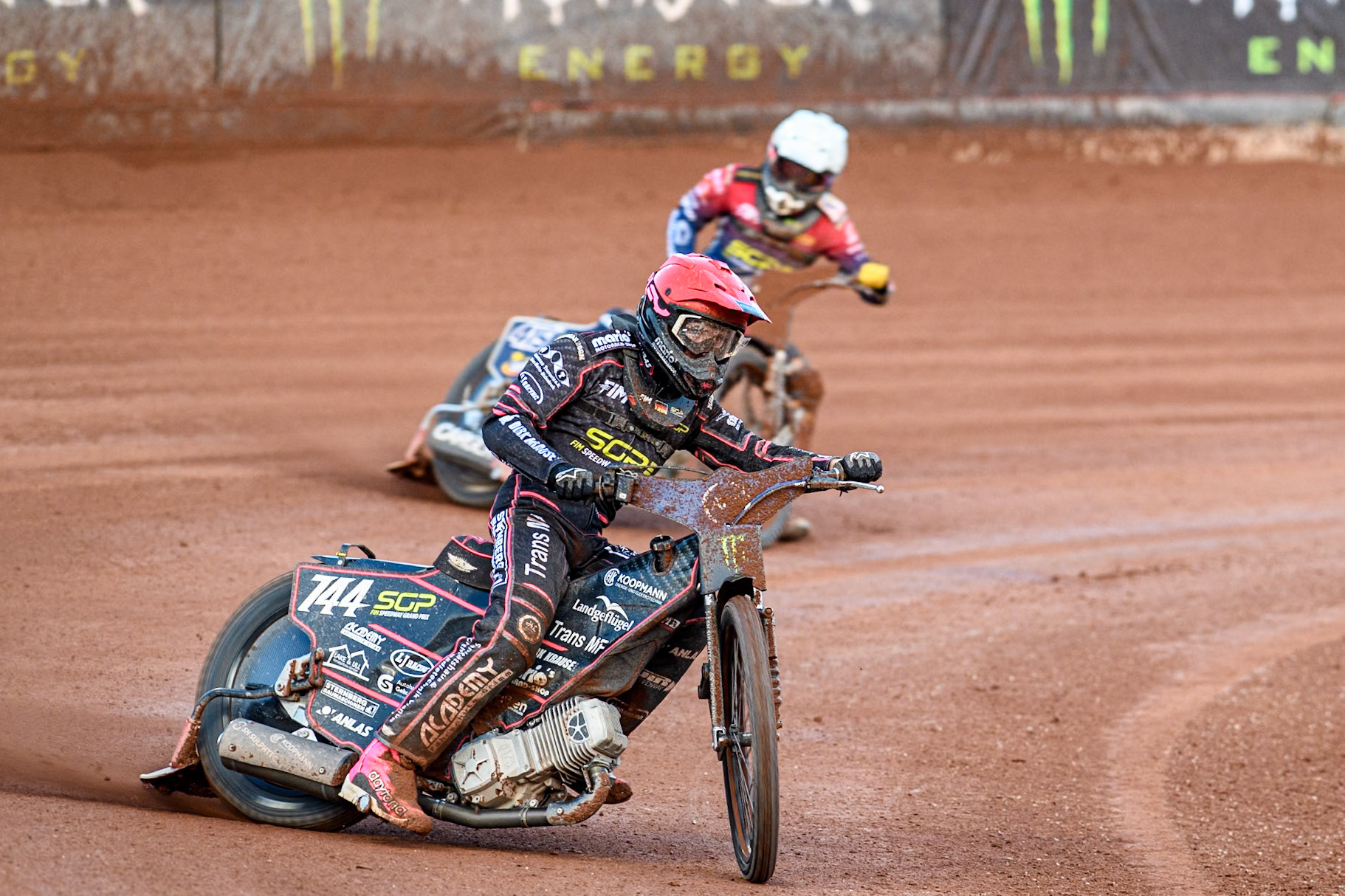 Kai Huckenbeck (744) of Germany in Red leading Dominik Kubera (415) of Poland in White during the ATPI FIM Speedway Grand Prix Round 5 at the National Speedway Stadium, Manchester, on Saturday 14th June 2025. (Photo: Ian Charles | MI News)