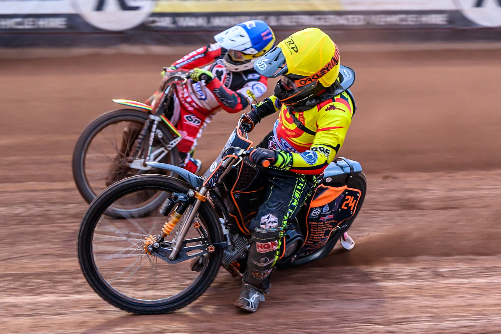 Birmingham Brummies' Guest Rider Jack Smith in Yellow rides inside Belle Vue Aces' Tate Zischke in Blue during the Rowe Motor Oil Premiership match between Belle Vue Aces and Birmingham Brummies at the National Speedway Stadium, Manchester on Monday 7th July 2025. (Photo: Ian Charles | MI News)