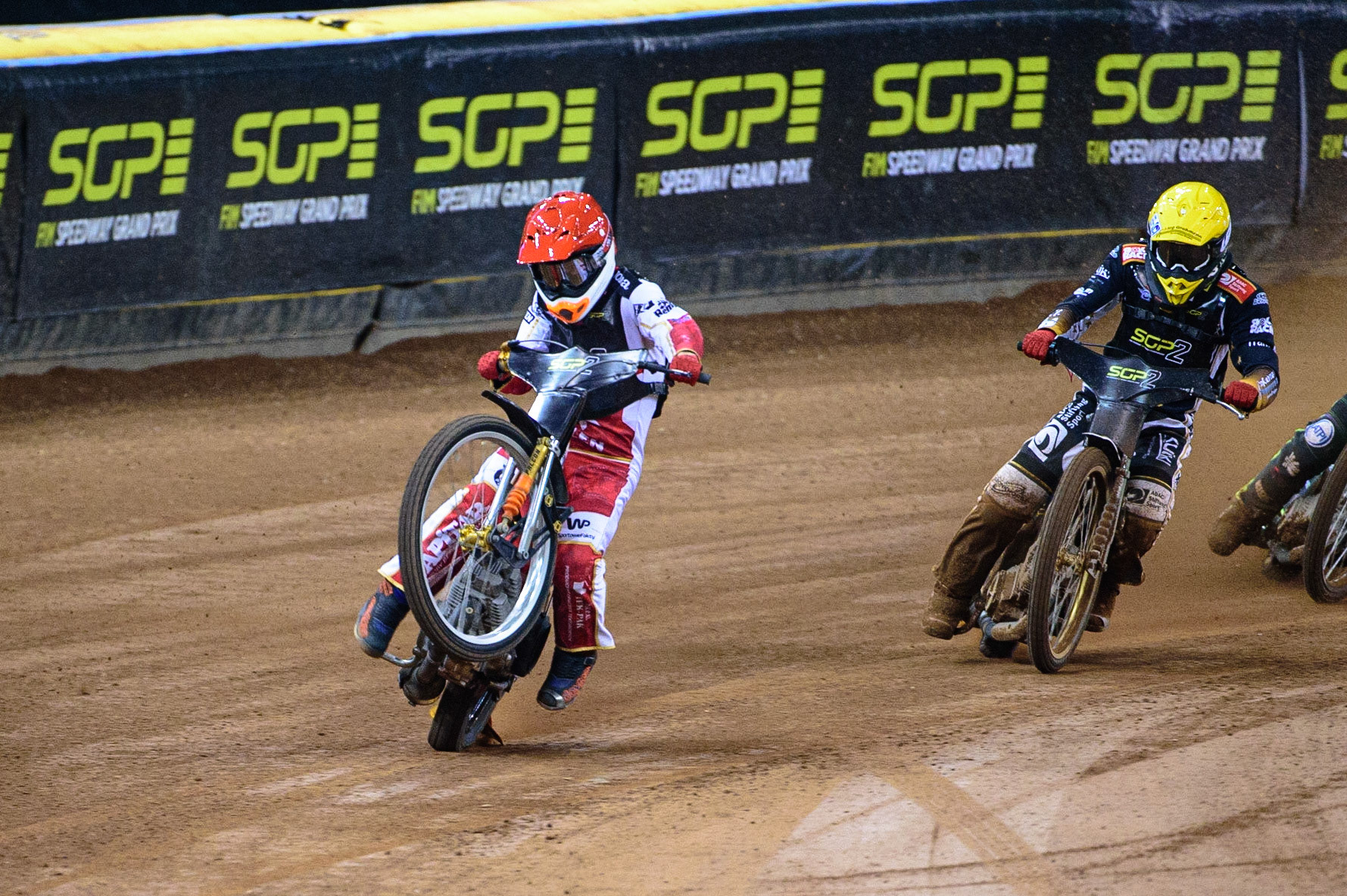 Mateusz Cierniak (Poland)  (Red) picks up some drive coming out of the 2nd turn ahead of Norick Blodorn (Germany)  (Yellow) during the FIM  Speedway Grand Prix  2 of Great Britain at the Principality Stadium, Cardiff on Sunday 14th August 2022. (Credit: Ian Charles | MI News)