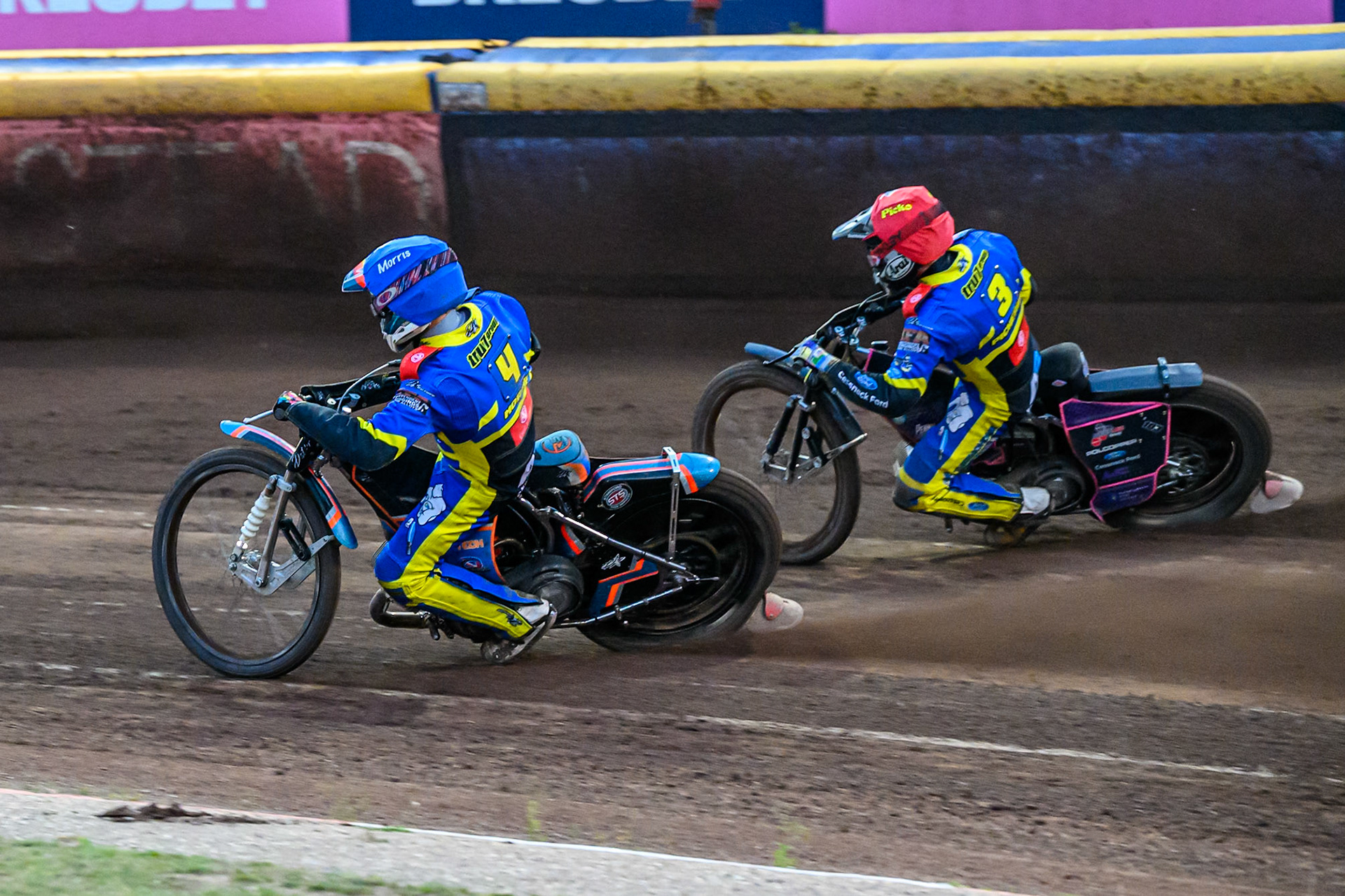 Nick Morris of Sheffield Tigers  in Blue on the inside  of Josh Pickering of Sheffield Tigers in Red during the Rowe Motor Oil Premiership match between Sheffield Tigers and Belle Vue Aces at Owlerton Stadium, Sheffield on Monday 11th August 2025. (Photo: Ian Charles | MI News)