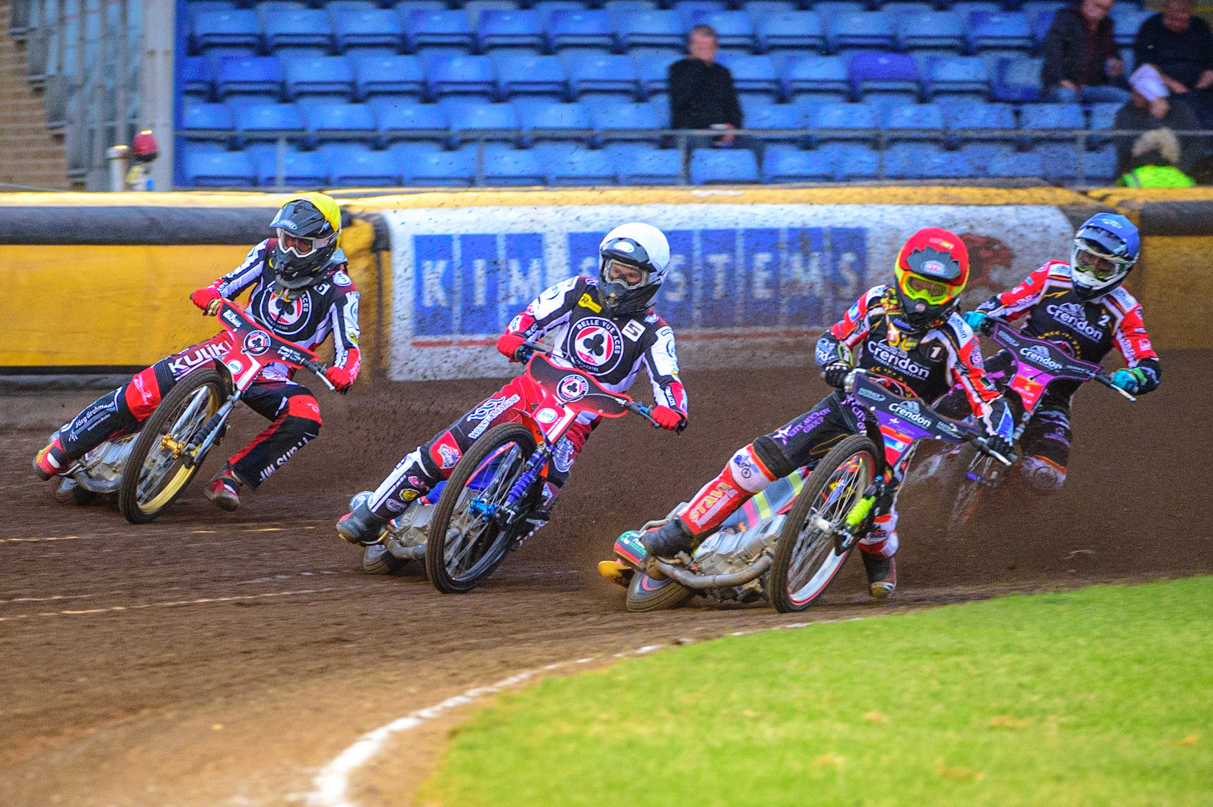 PETERBOROUGH, UK. MAY 9TH  Michael Palm Toft  (Red) inside Brady Kurtz  (White) and Norick Blödorn  (Yellow) with Scott Nicholls  (Blue) behind during the SGB Premiership match between Peterborough Panthers and Belle Vue Aces at East of England Showground, Peterborough on Monday 9th May 2022. (Credit: Ian Charles | MI News)