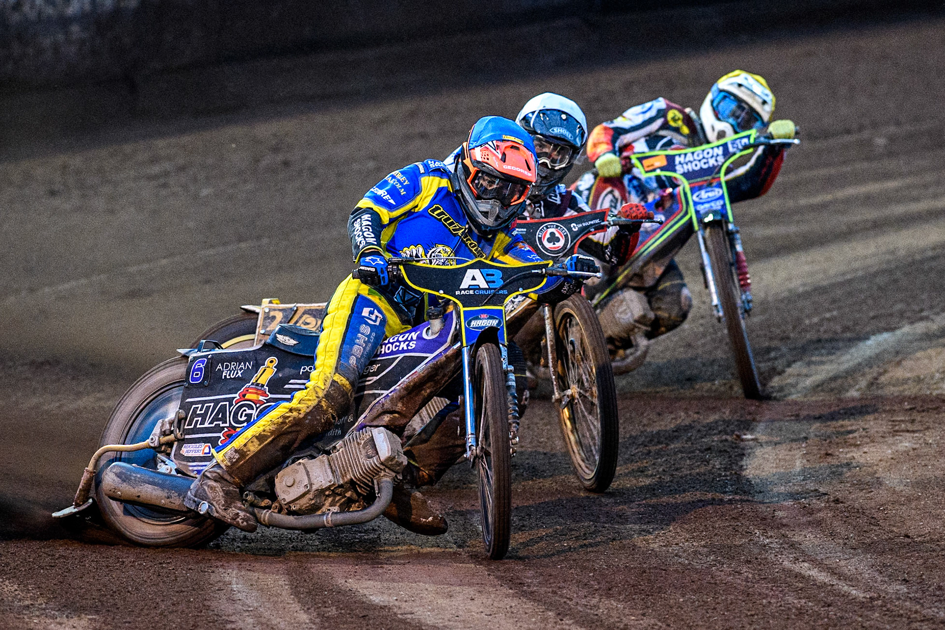Sheffield Tigers' Jason Edwards  in Blue leading Belle Vue Aces' Norick Blödorn  in White and Belle Vue Aces' Jake Mulford  in Yellow during the Rowe Motor Oil Premiership match between Sheffield Tigers and Belle Vue Aces at Owlerton Stadium, Sheffield on Monday 26th August 2024. (Photo: Ian Charles | MI News)