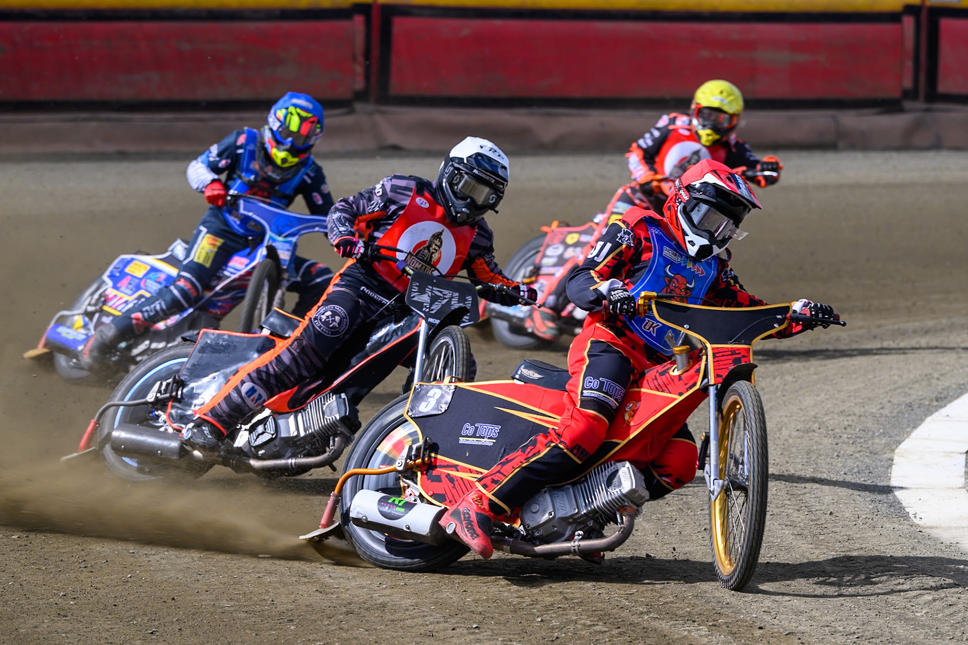 Luke Harris of Buxton Bulls   in Red leading Jack Roberts of NDL Nomads  in White with Jamie Etherington of Buxton Bulls in Blue and Alex Spooner of NDL Nomads   in Yellow behind during the  Challenge match between Buxton Bulls and NDL Nomads at Hi-Edge Speedway, Buxton on Sunday 19th April 2026. (Photo: Ian Charles | MI News)