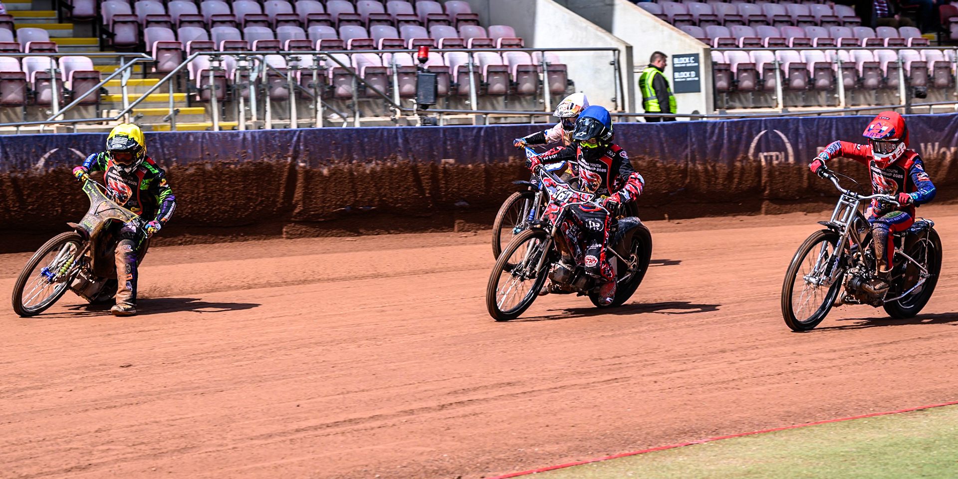 125cc Class: Lewis Hague (322) in Yellow leading367\ in Blue, Fraser Buckle (555) in Red and Reuben Marsh (26) in White during the British Youth Championship (125cc) Round 2A, at the National Speedway Stadium, Manchester on Sunday 1st June 2025. (Photo: Ian Charles | MI News)