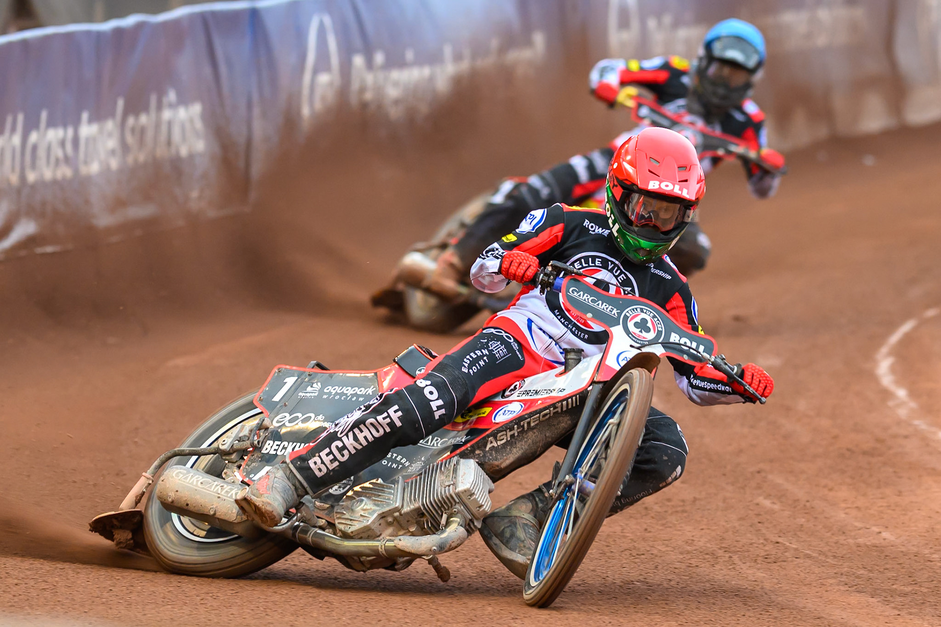 Brady Kurtz of Belle Vue Aces in Red leading Norick Blödorn of Belle Vue Aces in Blue during the Rowe Motor Oil Premiership match between Belle Vue Aces and Leicester Lions at the National Speedway Stadium, Manchester on Monday 15th June 2026. (Photo: Ian Charles | MI News)