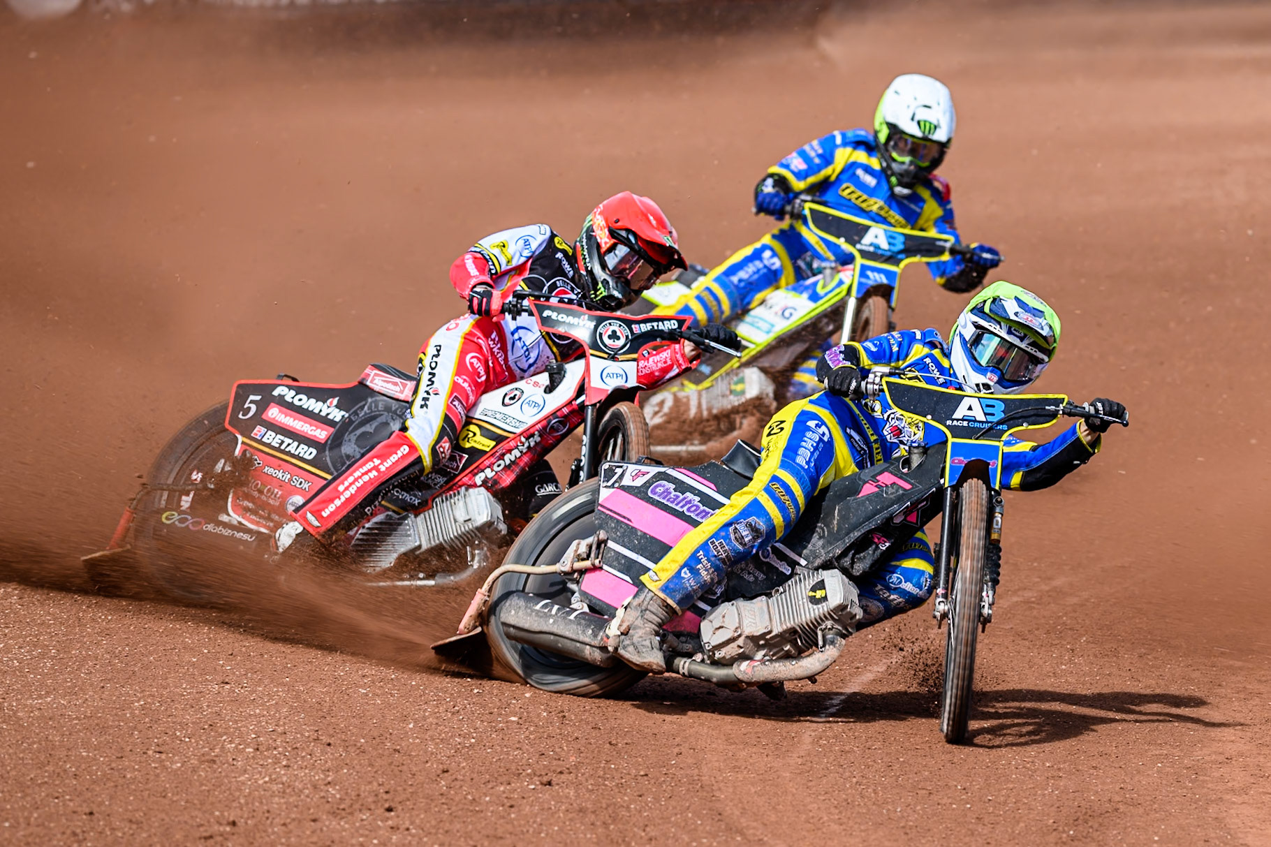 Leon Flint of Sheffield Tigers  in Yellow leading Dan Bewley of Belle Vue Aces  in Red and Chris Holder of Sheffield Tigers  in White during the Rowe Motor Oil Premiership match between Belle Vue Aces and Sheffield Tigers at the National Speedway Stadium, Manchester on Monday 25th August 2025. (Photo: Ian Charles | MI News)