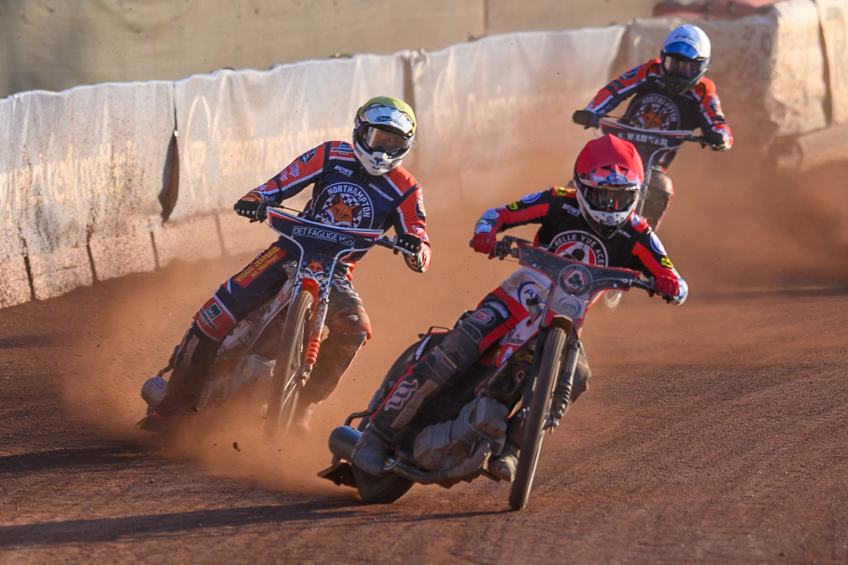 Zach Cook of Belle Vue Aces  in Red leading Niels-Kristian Iversen of Northampton Foxes in Yellow andMatej Zagar of Northampton Foxes in White during the Rowe Motor Oil Premiership match between Belle Vue Aces and Northampton Foxes at the National Speedway Stadium, Manchester on Monday 13th July 2026. (Photo: Ian Charles | MI News)