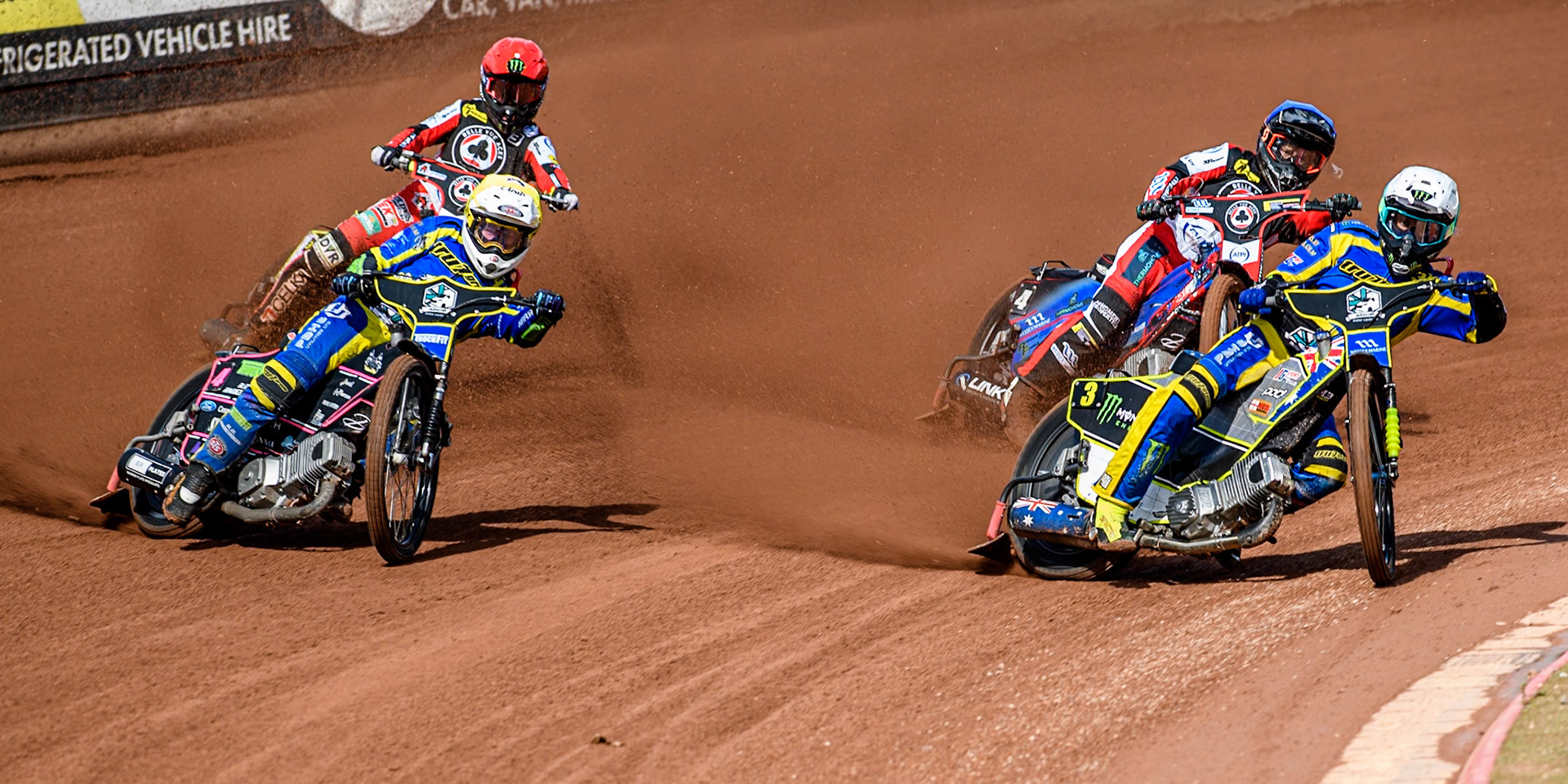 st3\ in White and Sheffield Tigers' Josh Pickering  in Yellow leading Belle Vue Aces' Ben Cook  in Blue and Belle Vue Aces' Jaimon Lidsey  in Red during the Rowe Motor Oil Premiership match between Belle Vue Aces and Sheffield Tigers at the National Speedway Stadium, Manchester on Monday 26th August 2024. (Photo: Ian Charles | MI News)