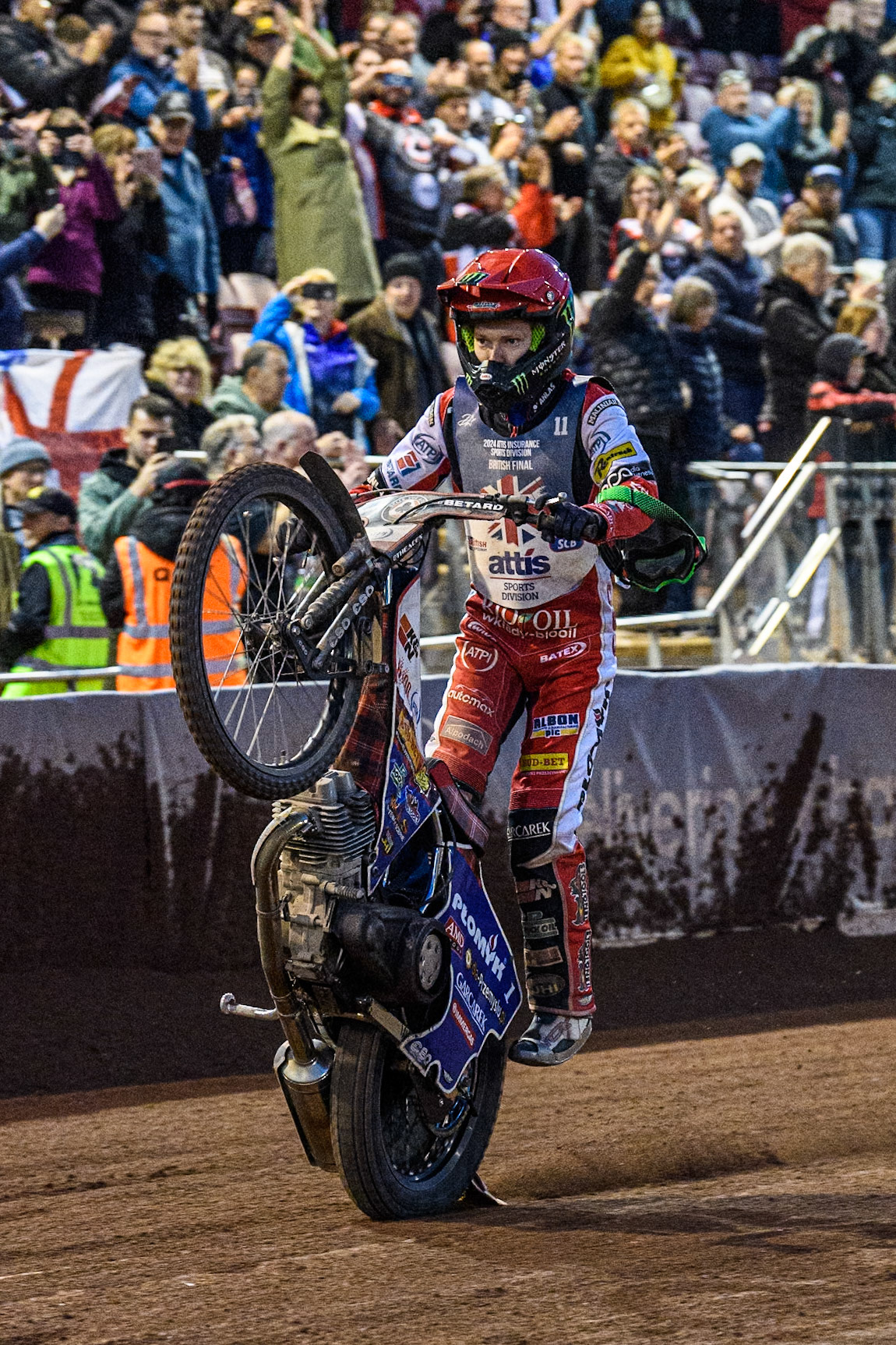 Dan Bewley celebrates with a wheelie during the Attis Insurance Sports Division British Speedway Championship Final at the National Speedway Stadium, Manchester on Saturday 8th June 2024. (Photo: Ian Charles | MI News)