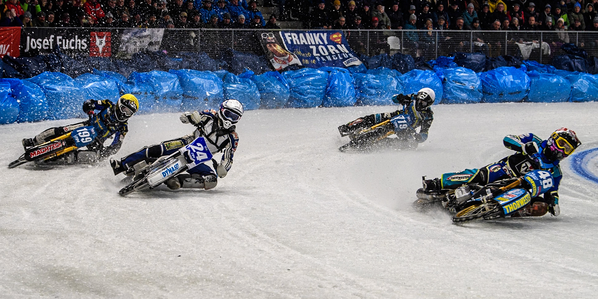 Luca Bauer (48) of Germany in Red leading Max Koivula (24) of Finland in White, Martin Haarahiltunen (199) of Sweden in Yellow and Filip Jäger (719) of Sweden in Blue during the Ice Speedway Gladiators World Championship Final 2 at Max-Aicher-Arena, Inzell on Sunday 16th March 2025. (Photo: Ian Charles | MI News)