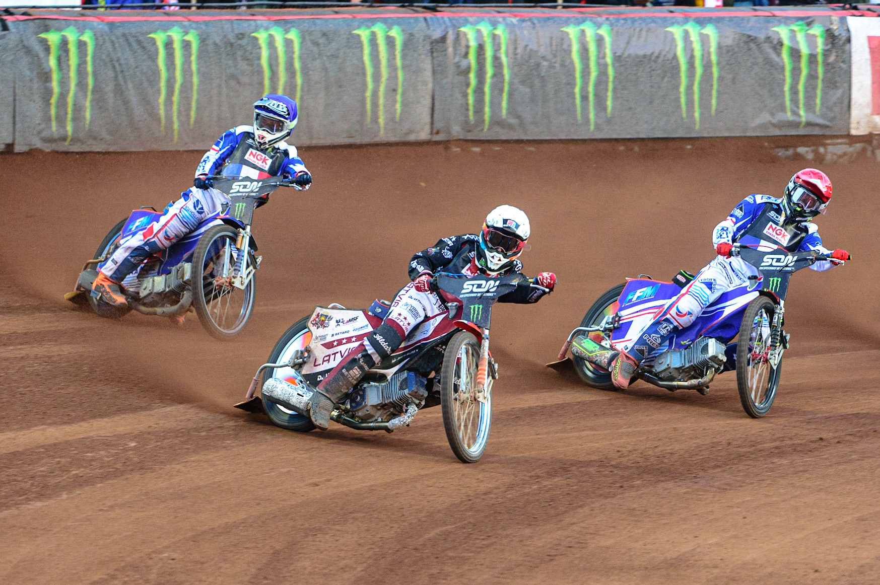 MANCHESTER, UK. OCT 16TH Andzejs Lebedevs of Latvia (White) leads David Bellego of France (Red) and Dmitri Berge of France (Blue) during the Monster Energy FIM Speedway of Nations at the National Speedway Stadium, Manchester on Saturday  16th October 2021. (Credit: Ian Charles | MI News)