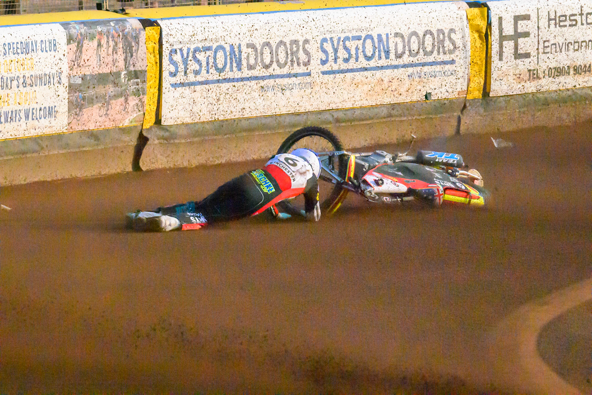 Tate Zischke of Belle Vue Aces in White loses control and flips off his bike during the Rowe Motor Oil Premiership match between Leicester Lions and Belle Vue Aces at the Hydroscan Arena, Leicester on Thursday 23rd July 2026. (Photo: Ian Charles | MI News)